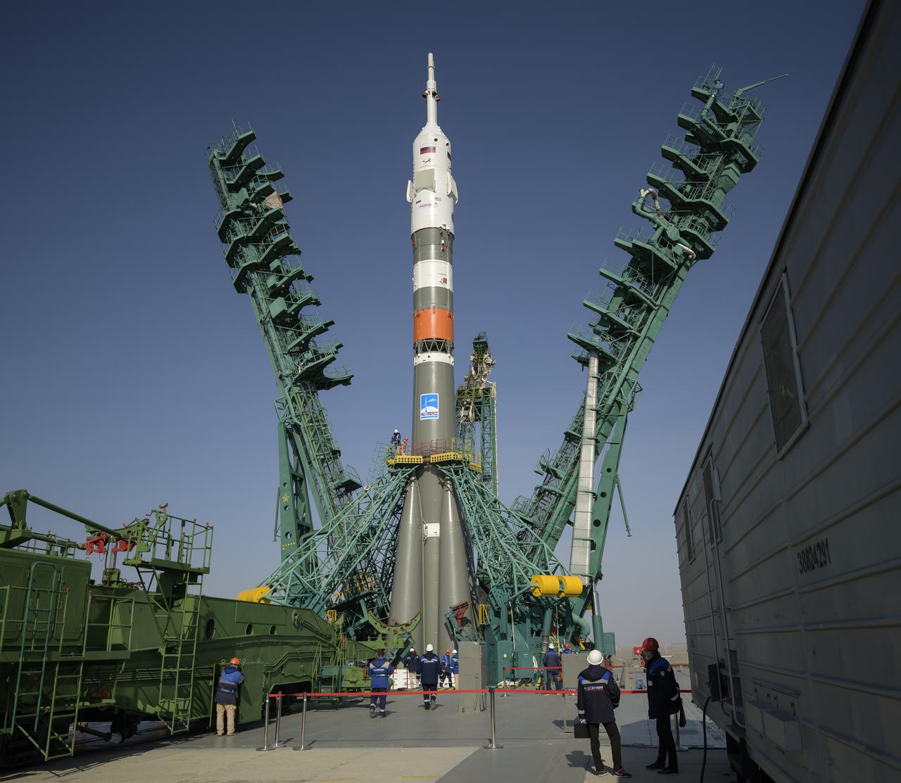 The service structure is lifted into position around the Soyuz rocket, Tuesday, April 6, 2021, at site 31 of the Baikonur Cosmodrome in Kazakhstan. Expedition 65 NASA astronaut Mark Vande Hei, Roscosmos cosmonauts Pyotr Dubrov and Oleg Novitskiy are scheduled to launch aboard their Soyuz MS-18 spacecraft on April 9. Photo Credit: (NASA/Bill Ingalls)