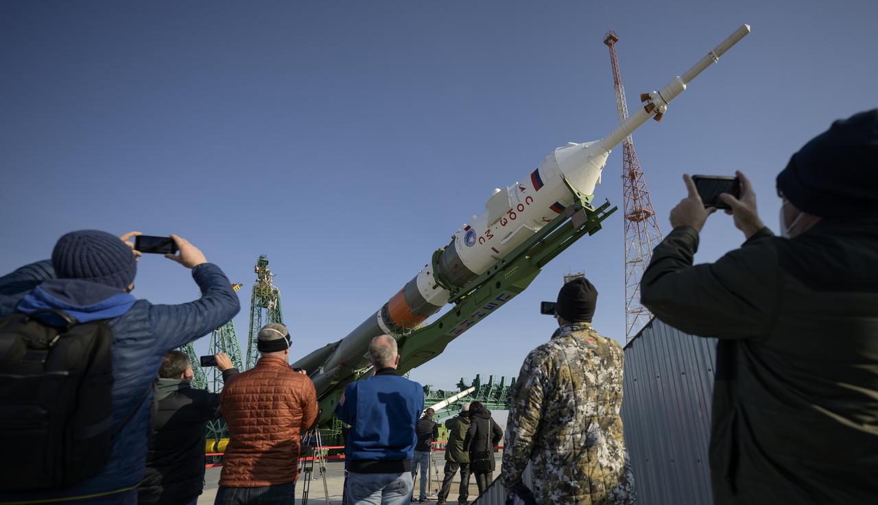 The Soyuz rocket is raised vertical after having rolled out by train to the launch pad at Site 31, Tuesday, April 6, 2021, at the Baikonur Cosmodrome in Kazakhstan. Expedition 65 NASA astronaut Mark Vande Hei, Roscosmos cosmonauts Pyotr Dubrov and Oleg Novitskiy are scheduled to launch aboard their Soyuz MS-18 spacecraft on April 9. Photo Credit: (NASA/Bill Ingalls)