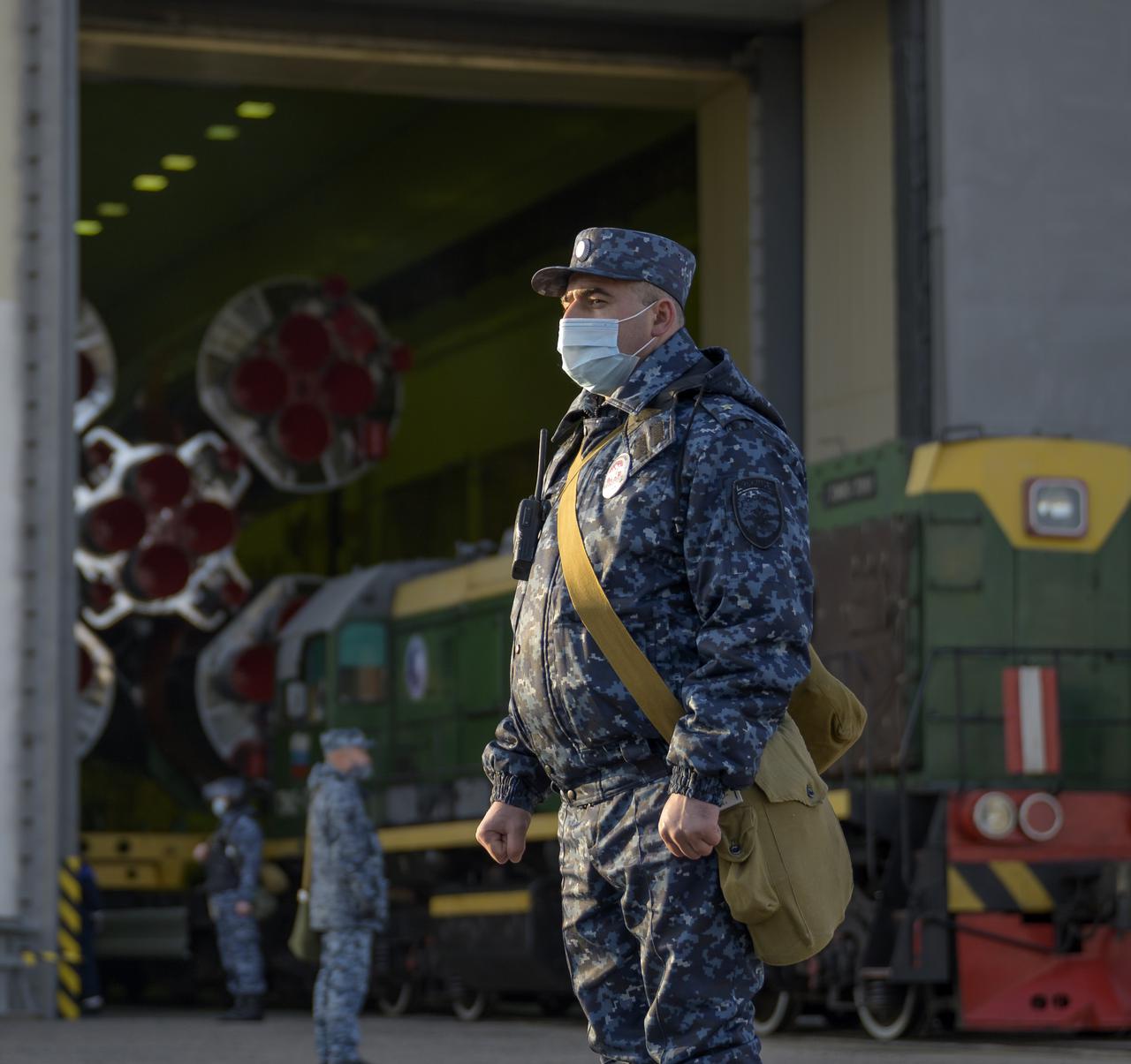 Security forces keep watch as the Soyuz rocket is rolled out by train to the launch pad at Site 31, Tuesday, April 6, 2021, at the Baikonur Cosmodrome in Kazakhstan. Expedition 65 NASA astronaut Mark Vande Hei, Roscosmos cosmonauts Pyotr Dubrov and Oleg Novitskiy are scheduled to launch aboard their Soyuz MS-18 spacecraft on April 9. Photo Credit: (NASA/Bill Ingalls)