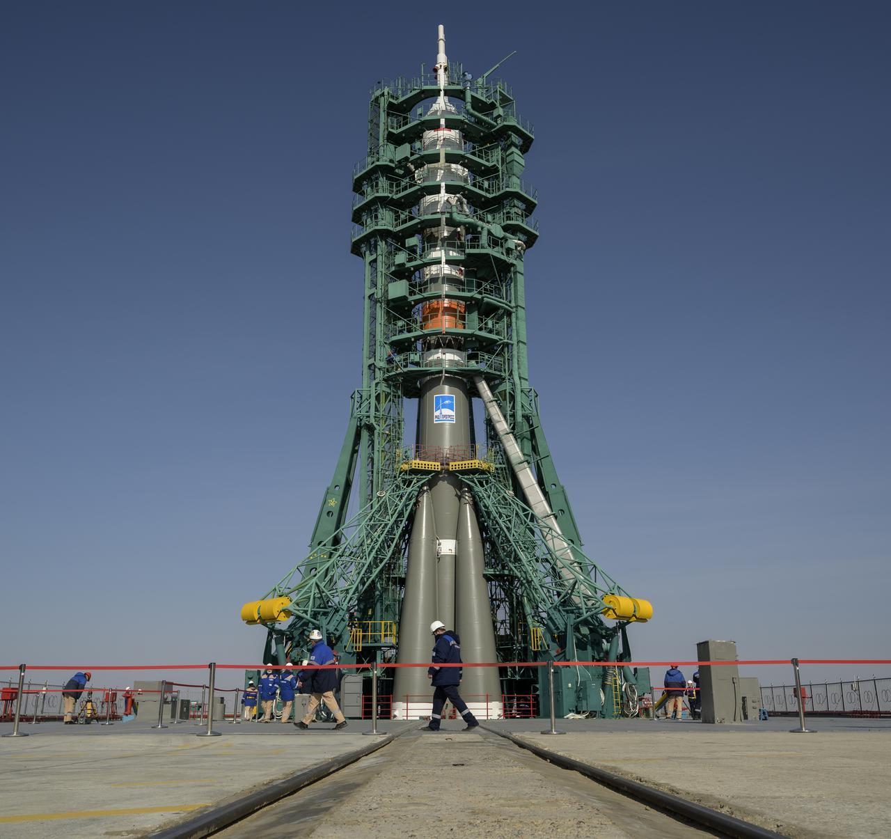 The service structure is raised into position around the Soyuz rocket, Tuesday, April 6, 2021, at site 31 of the Baikonur Cosmodrome in Kazakhstan. Expedition 65 NASA astronaut Mark Vande Hei, Roscosmos cosmonauts Pyotr Dubrov and Oleg Novitskiy are scheduled to launch aboard their Soyuz MS-18 spacecraft on April 9. Photo Credit: (NASA/Bill Ingalls)