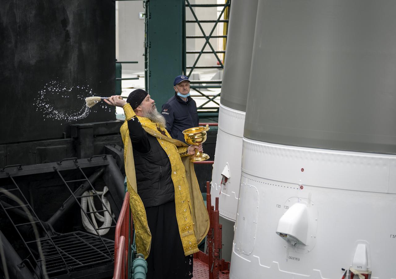 Russian Orthodox Priest Father Sergei blesses the Soyuz rocket at the Baikonur Cosmodrome launch pad, Thursday, April 8, 2021 in Kazakhstan. Expedition 65 NASA astronaut Mark Vande Hei, Roscosmos cosmonauts Pyotr Dubrov and Oleg Novitskiy are scheduled to launch aboard their Soyuz MS-18 spacecraft on April 9.  Photo Credit: (NASA/Bill Ingalls)