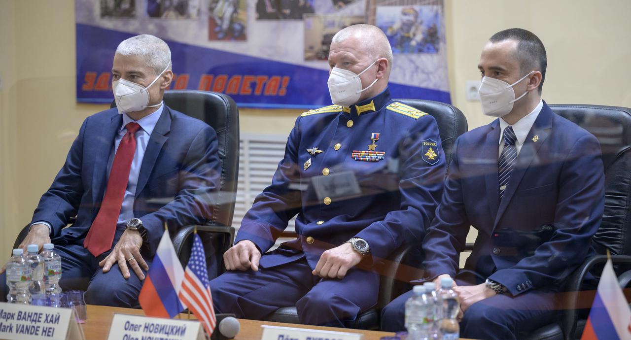 Expedition 65 NASA astronaut Mark Vande Hei, left, Roscosmos cosmonauts Oleg Novitskiy and Pyotr Dubrov, right, are seen during the State Commission meeting to approve the Soyuz launch of Expedition 65 to the International Space Station, Thursday, April 8, 2021 at the Cosmonaut Hotel in Baikonur, Kazakhstan. The trio are scheduled to launch to the International Space Station aboard the Soyuz MS-18 spacecraft on April 9. Photo Credit: (NASA/Bill Ingalls)