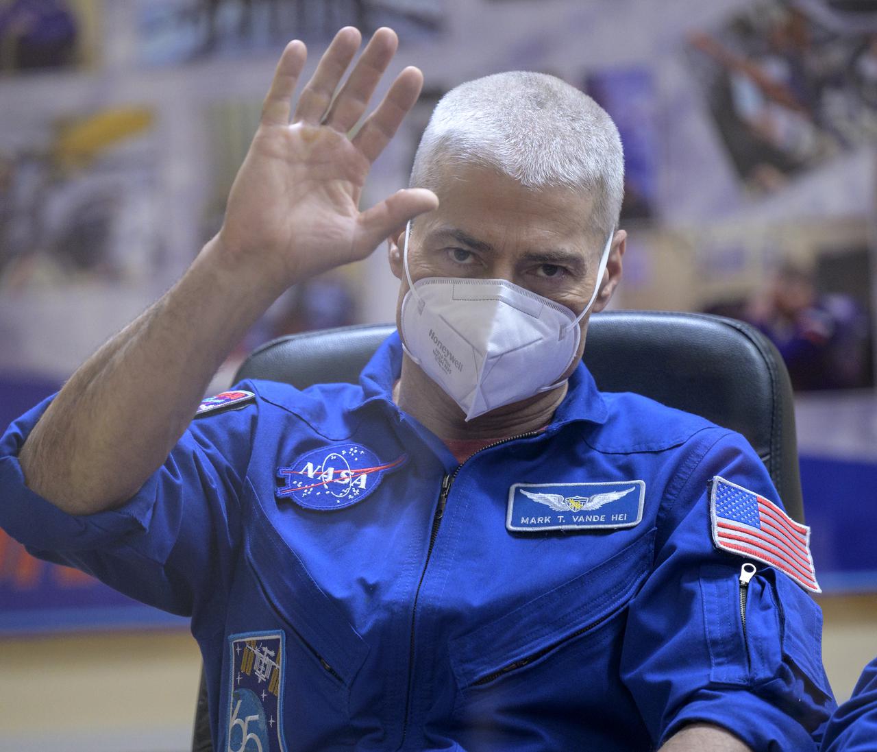 Expedition 65 NASA astronaut Mark Vande Hei is seen in quarantine, behind glass, during a press conference, Thursday, April 8, 2021 a the Cosmonaut Hotel in Baikonur, Kazakhstan. Expedition 65 Roscosmos cosmonauts Pyotr Dubrov, Oleg Novitskiy and NASA’s Vande Hei are scheduled to launch to the International Space Station aboard the Soyuz MS-18 spacecraft on April 9. Photo Credit: (NASA/Bill Ingalls)