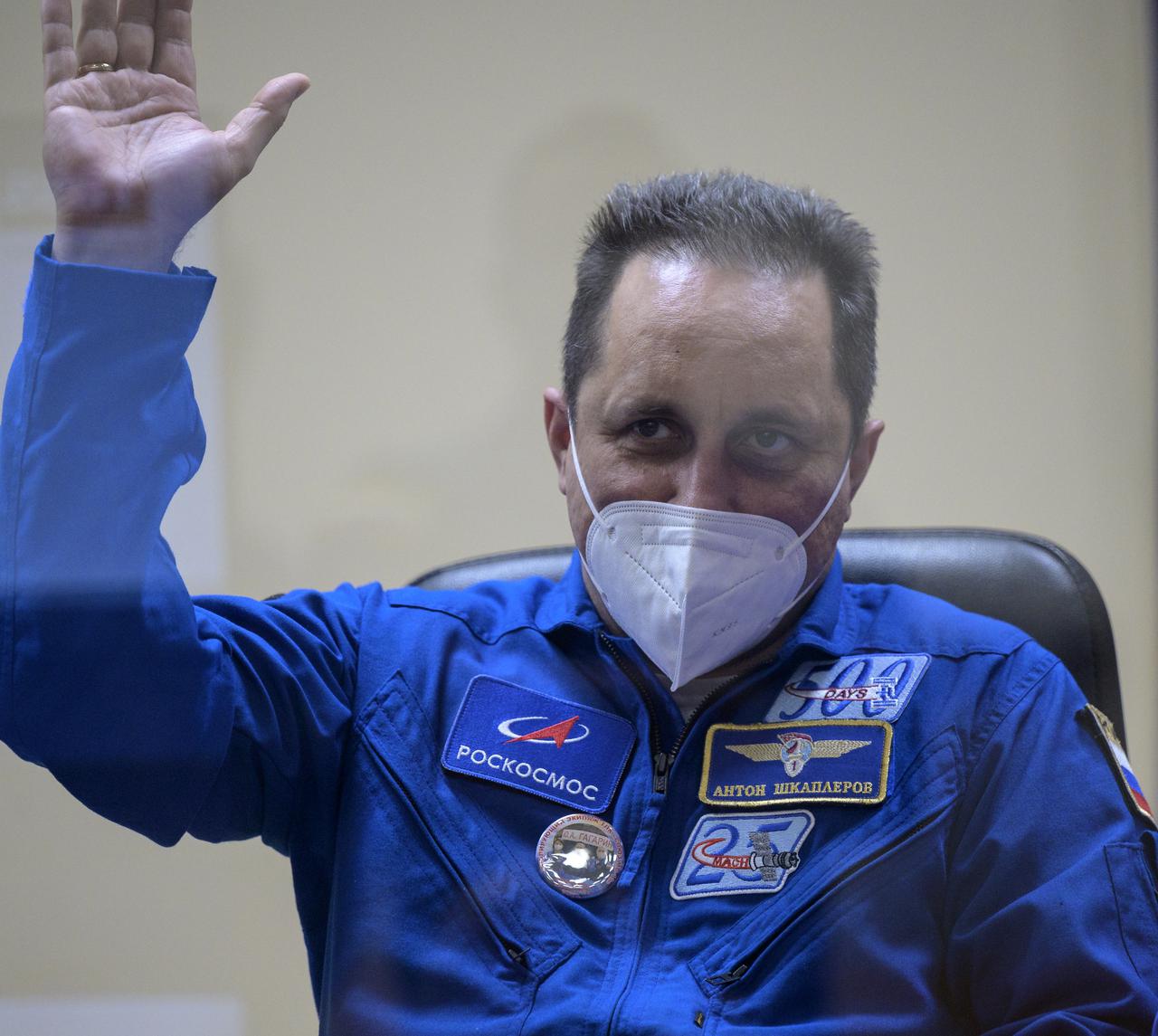 Expedition 65 backup crew member Anton Shkaplerov of Roscosmos, is seen in quarantine, behind glass, during a press conference, Thursday, April 8, 2021 a the Cosmonaut Hotel in Baikonur, Kazakhstan. Expedition 65 NASA astronaut Mark Vande Hei, Roscosmos cosmonauts Pyotr Dubrov and Oleg Novitskiy are scheduled to launch to the International Space Station aboard the Soyuz MS-18 spacecraft on April 9.  Photo Credit: (NASA/Bill Ingalls)