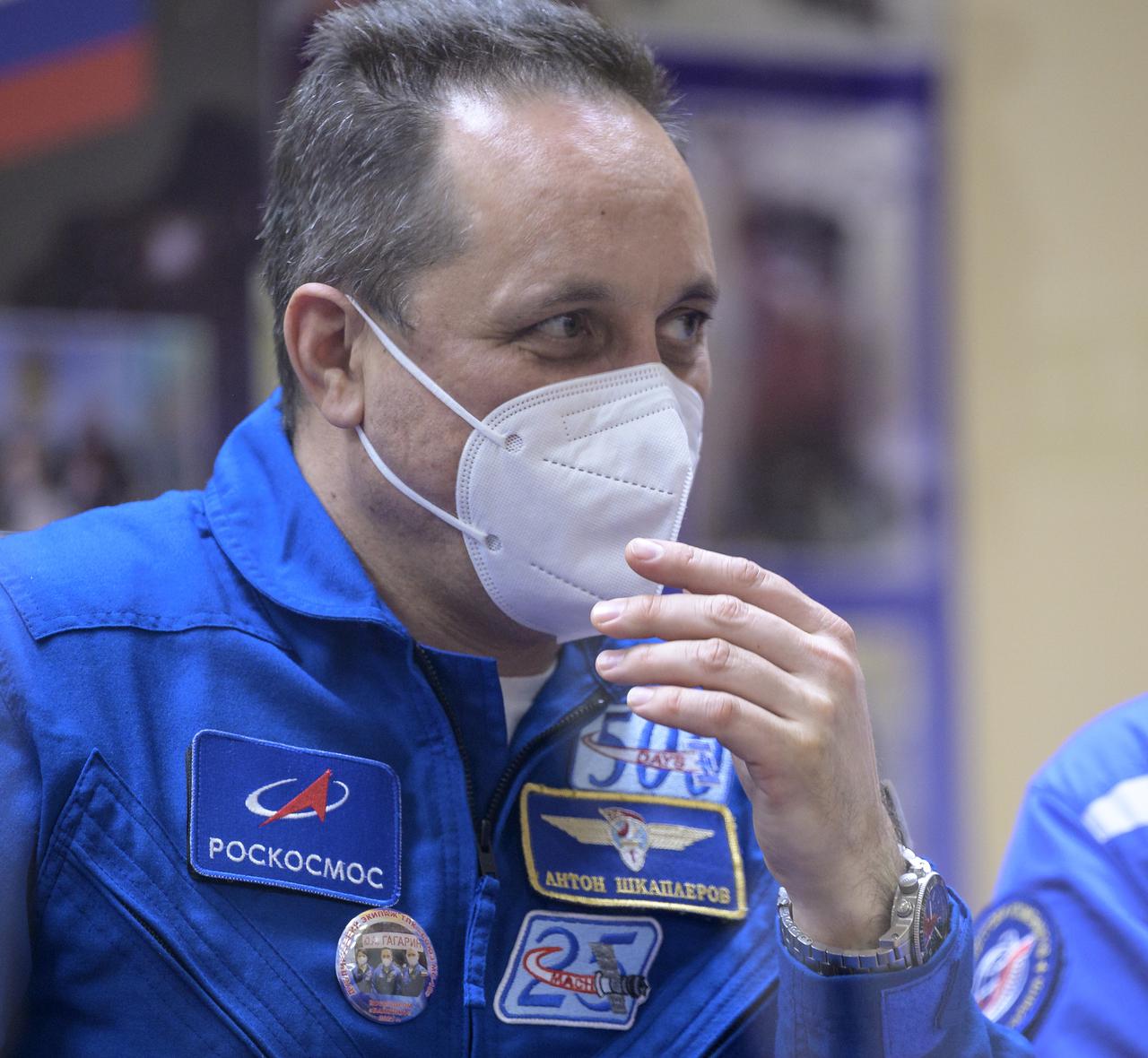 Expedition 65 backup crew member Anton Shkaplerov of Roscosmos is seen in quarantine, behind glass, during a press conference, Thursday, April 8, 2021 a the Cosmonaut Hotel in Baikonur, Kazakhstan. Expedition 65 NASA astronaut Mark Vande Hei, Roscosmos cosmonauts Pyotr Dubrov and Oleg Novitskiy are scheduled to launch to the International Space Station aboard the Soyuz MS-18 spacecraft on April 9.  Photo Credit: (NASA/Bill Ingalls)