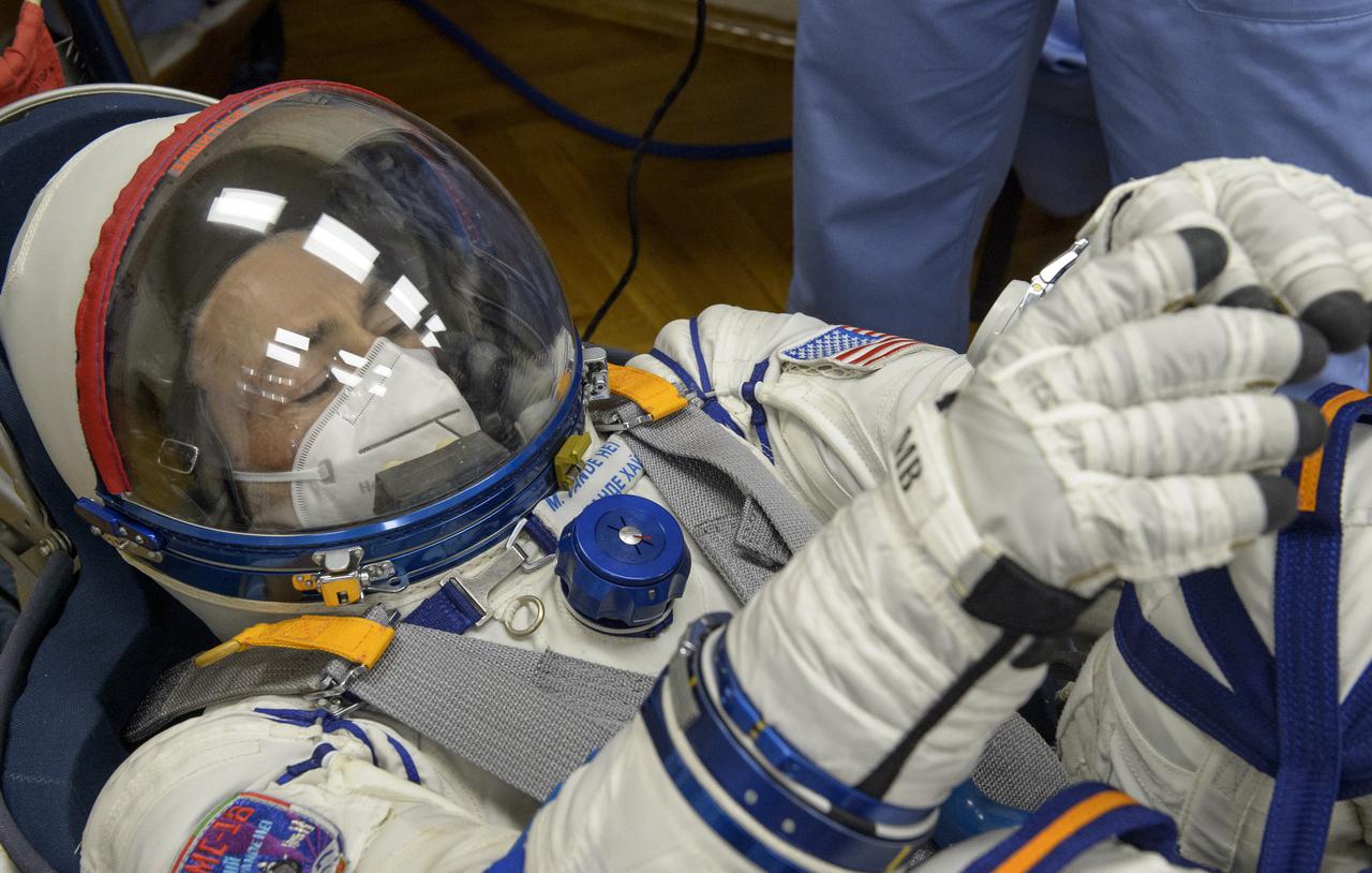Expedition 65 NASA astronaut Mark Vande Hei has his Russian Sokol suit pressure checked as he and fellow crewmates, Russian cosmonauts Pyotr Dubrov and Oleg Novitskiy prepare for their Soyuz launch to the International Space Station Friday, April 9, 2021 in Baikonur, Kazakhstan. Launch of the Soyuz rocket sent the trio on a mission to the International Space Station. Photo Credit: (NASA/GCTC/Irina Spector)
