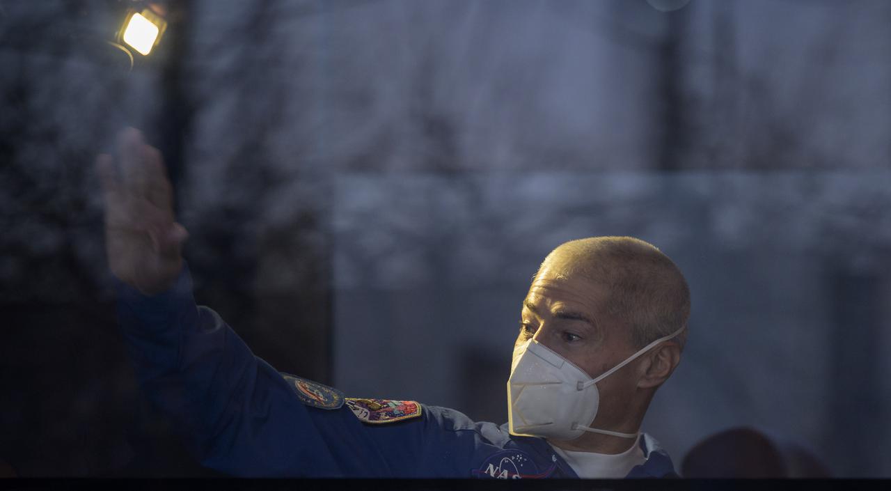 Expedition 65 NASA astronaut Mark Vande Hei waves as he departs the Cosmonaut Hotel to suit-up with Russian cosmonauts Oleg Novitskiy and Pyotr Dubrov for their Soyuz launch to the International Space Station, Friday, April 9, 2021, in Baikonur, Kazakhstan. Photo Credit: (NASA/Bill Ingalls)