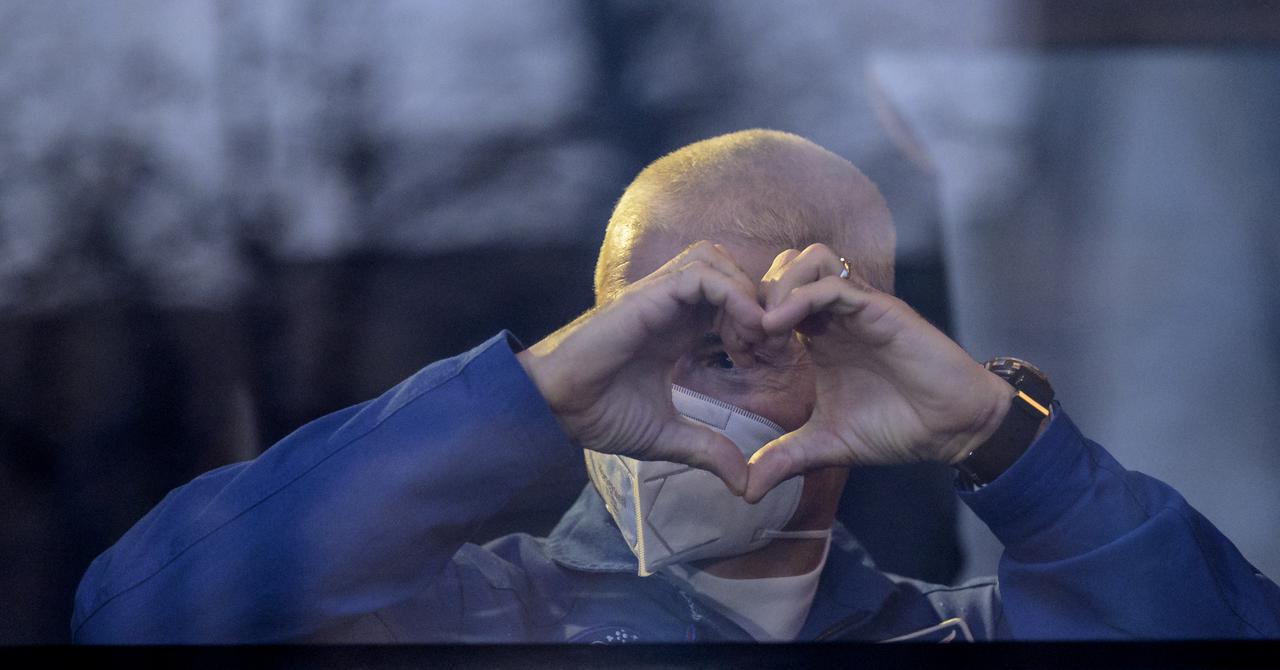 Expedition 65 NASA astronaut Mark Vande Hei waves as he departs the Cosmonaut Hotel to suit-up with Russian cosmonauts Oleg Novitskiy and Pyotr Dubrov for their Soyuz launch to the International Space Station, Friday, April 9, 2021, in Baikonur, Kazakhstan. Photo Credit: (NASA/Bill Ingalls)