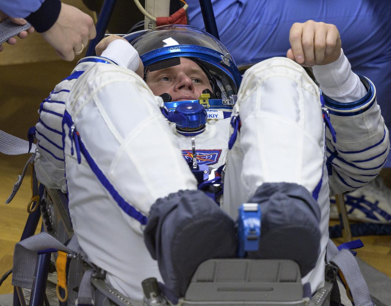 Expedition 65 Russian cosmonaut Oleg Novitskiy has his Russian Sokol suit pressure checked as he and fellow crewmates Russian cosmonaut Pyotr Dubrov and NASA astronaut Mark Vande Hei, prepare for their Soyuz launch to the International Space Station Friday, April 9, 2021 in Baikonur, Kazakhstan. Launch of the Soyuz rocket sent the trio on a mission to the International Space Station. Photo Credit: (NASA/Bill Ingalls)