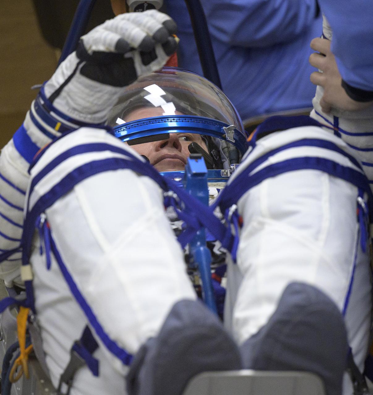 Expedition 65 Russian cosmonaut Oleg Novitskiy has his Russian Sokol suit pressure checked as he and fellow crewmates Russian cosmonaut Pyotr Dubrov and NASA astronaut Mark Vande Hei, prepare for their Soyuz launch to the International Space Station Friday, April 9, 2021 in Baikonur, Kazakhstan. Launch of the Soyuz rocket sent the trio on a mission to the International Space Station. Photo Credit: (NASA/Bill Ingalls)