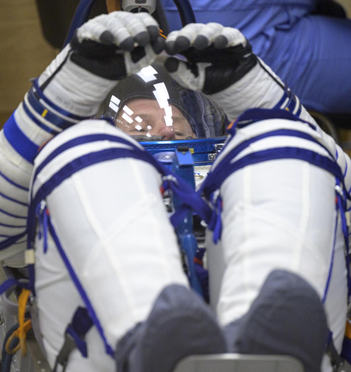 Expedition 65 Russian cosmonaut Oleg Novitskiy has his Russian Sokol suit pressure checked as he and fellow crewmates Russian cosmonaut Pyotr Dubrov and NASA astronaut Mark Vande Hei, prepare for their Soyuz launch to the International Space Station Friday, April 9, 2021 in Baikonur, Kazakhstan. Launch of the Soyuz rocket sent the trio on a mission to the International Space Station. Photo Credit: (NASA/Bill Ingalls)