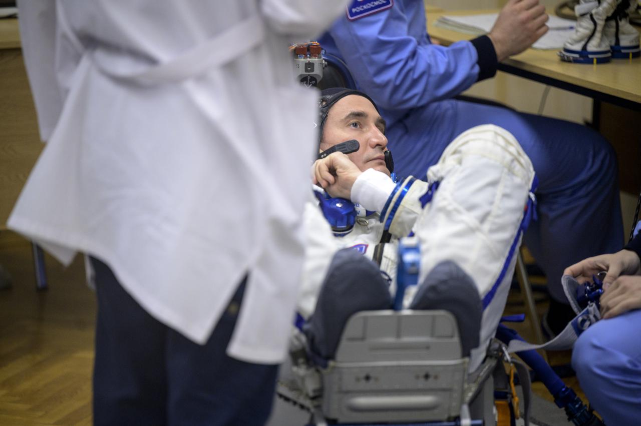 Expedition 65 Russian cosmonaut Pyotr Dubrov has his Russian Sokol suit pressure checked as he and fellow crewmates Russian cosmonaut Oleg Novitskiy and NASA astronaut Mark Vande Hei, prepare for their Soyuz launch to the International Space Station Friday, April 9, 2021 in Baikonur, Kazakhstan. Launch of the Soyuz rocket sent the trio on a mission to the International Space Station. Photo Credit: (NASA/Bill Ingalls)