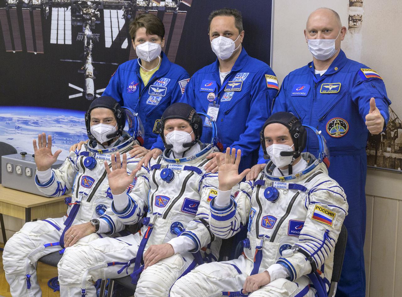 Expedition 65 prime crew members, front row, NASA astronaut Mark Vande Hei, left, Russian cosmonauts Oleg Novitskiy, center, and Pyotr Dubrov, have a group photo made with Expedition 65 backup crewmembers Anne McClain of NASA, standing left, Russian cosmonauts Anton Shkaplerov, standing center, and Oleg Artemyev ahead of the prime crews launch to the International Space Station Friday, April 9, 2021 in Baikonur, Kazakhstan. Launch of the Soyuz rocket sent the trio on a mission to the International Space Station. Photo Credit: (NASA/Bill Ingalls)