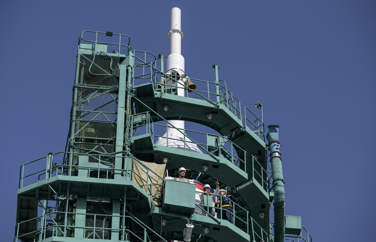 Engineers wait at the top of the Soyuz Rocket for boarding of Expedition 65 NASA astronaut Mark Vande Hei, Russian cosmonauts Oleg Novitskiy and Pyotr Dubrov, Friday, April 9, 2021 at the Baikonur Cosmodrome in Kazakhstan. Launch of the Soyuz rocket sent the trio on a mission to the International Space Station. Photo Credit: (NASA/Bill Ingalls)