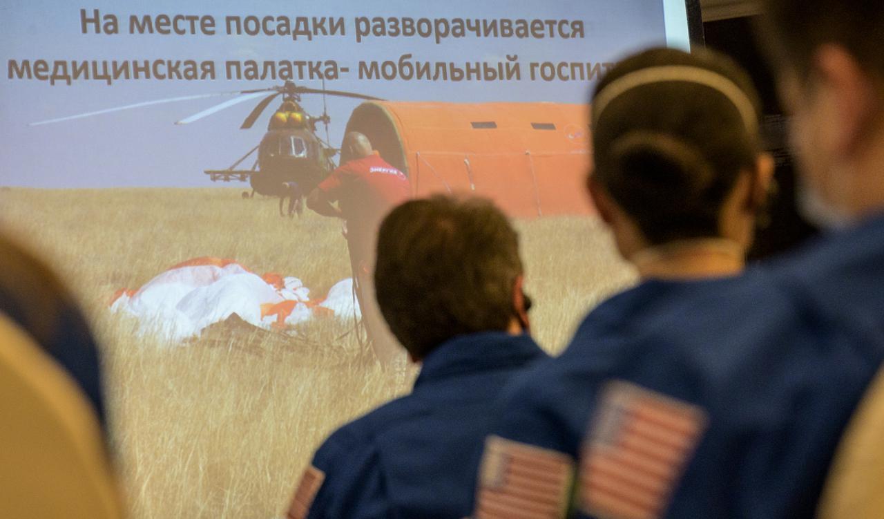 NASA, Roscosmos, and Russian Search and Recovery Forces meet at the Cosmonaut Hotel in Karaganda, Kazakhstan to discuss the readiness for the landing of Expedition 64 crew members Kate Rubins of NASA, Sergey Ryzhikov and Sergey Kud-Sverchkov of Roscosmos, Thursday, April 15, 2021, at the Cosmonaut Hotel in Karaganda. Rubins, Ryzhikov and Kud-Sverchkov will be returning after 185 days in space having served as Expedition 63-64 crew members onboard the International Space Station. Photo Credit: NASA/Bill Ingalls