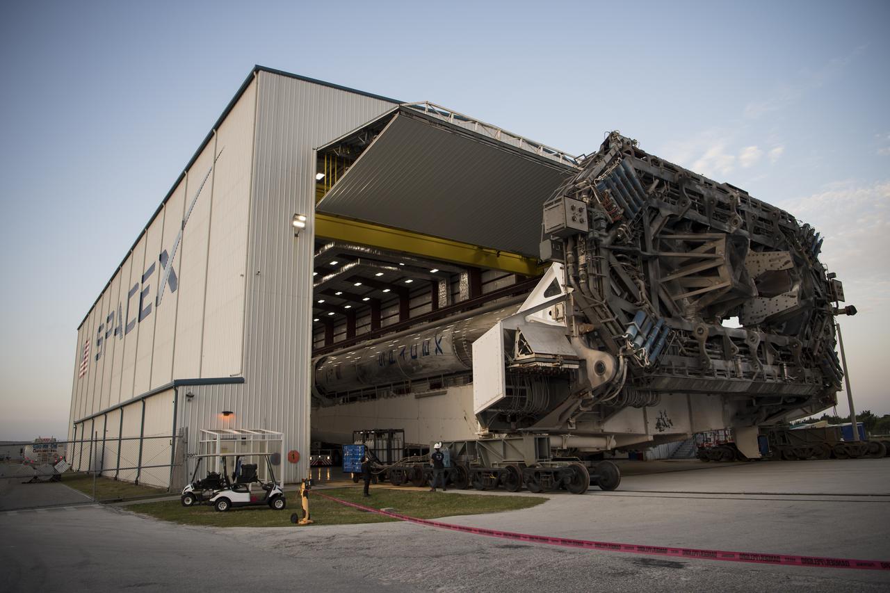 A SpaceX Falcon 9 rocket with the company's Crew Dragon spacecraft onboard is seen as it is rolled out of the horizontal integration facility at Launch Complex 39A as preparations continue for the Crew-2 mission, Friday, April 16, 2021, at NASA’s Kennedy Space Center in Florida. NASA’s SpaceX Crew-2 mission is the second crew rotation mission of the SpaceX Crew Dragon spacecraft and Falcon 9 rocket to the International Space Station as part of the agency’s Commercial Crew Program. NASA astronauts Shane Kimbrough and Megan McArthur, ESA (European Space Agency) astronaut Thomas Pesquet, and Japan Aerospace Exploration Agency (JAXA) astronaut Akihiko Hoshide are scheduled to launch at 6:11 a.m. ET on Thursday, April 22, from Launch Complex 39A at the Kennedy Space Center. Photo Credit: (NASA/Aubrey Gemignani)