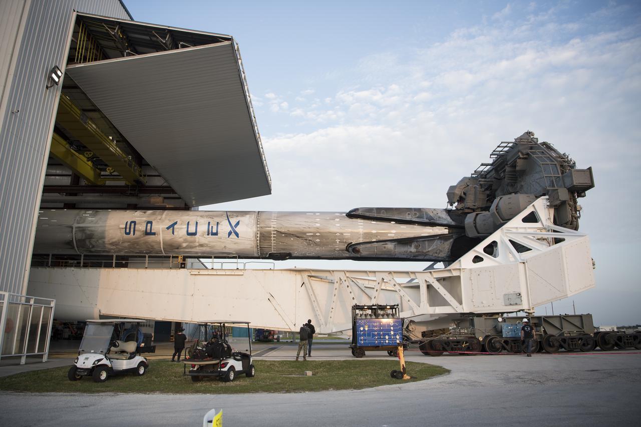 A SpaceX Falcon 9 rocket with the company's Crew Dragon spacecraft onboard is seen as it is rolled out of the horizontal integration facility at Launch Complex 39A as preparations continue for the Crew-2 mission, Friday, April 16, 2021, at NASA’s Kennedy Space Center in Florida. NASA’s SpaceX Crew-2 mission is the second crew rotation mission of the SpaceX Crew Dragon spacecraft and Falcon 9 rocket to the International Space Station as part of the agency’s Commercial Crew Program. NASA astronauts Shane Kimbrough and Megan McArthur, ESA (European Space Agency) astronaut Thomas Pesquet, and Japan Aerospace Exploration Agency (JAXA) astronaut Akihiko Hoshide are scheduled to launch at 6:11 a.m. ET on Thursday, April 22, from Launch Complex 39A at the Kennedy Space Center. Photo Credit: (NASA/Aubrey Gemignani)