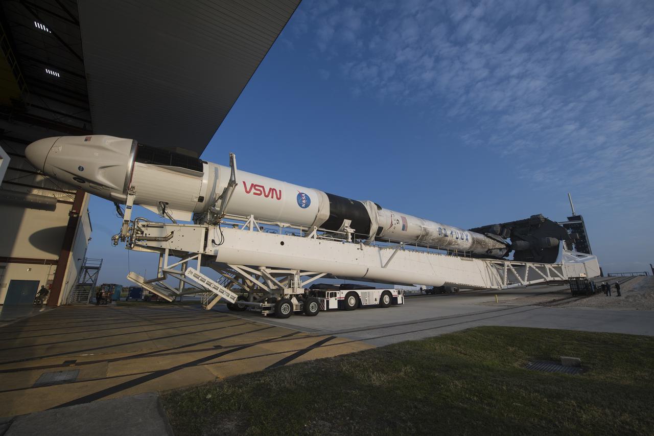 A SpaceX Falcon 9 rocket with the company's Crew Dragon spacecraft onboard is seen as it is rolled out of the horizontal integration facility at Launch Complex 39A as preparations continue for the Crew-2 mission, Friday, April 16, 2021, at NASA’s Kennedy Space Center in Florida. NASA’s SpaceX Crew-2 mission is the second crew rotation mission of the SpaceX Crew Dragon spacecraft and Falcon 9 rocket to the International Space Station as part of the agency’s Commercial Crew Program. NASA astronauts Shane Kimbrough and Megan McArthur, ESA (European Space Agency) astronaut Thomas Pesquet, and Japan Aerospace Exploration Agency (JAXA) astronaut Akihiko Hoshide are scheduled to launch at 6:11 a.m. ET on Thursday, April 22, from Launch Complex 39A at the Kennedy Space Center. Photo Credit: (NASA/Aubrey Gemignani)