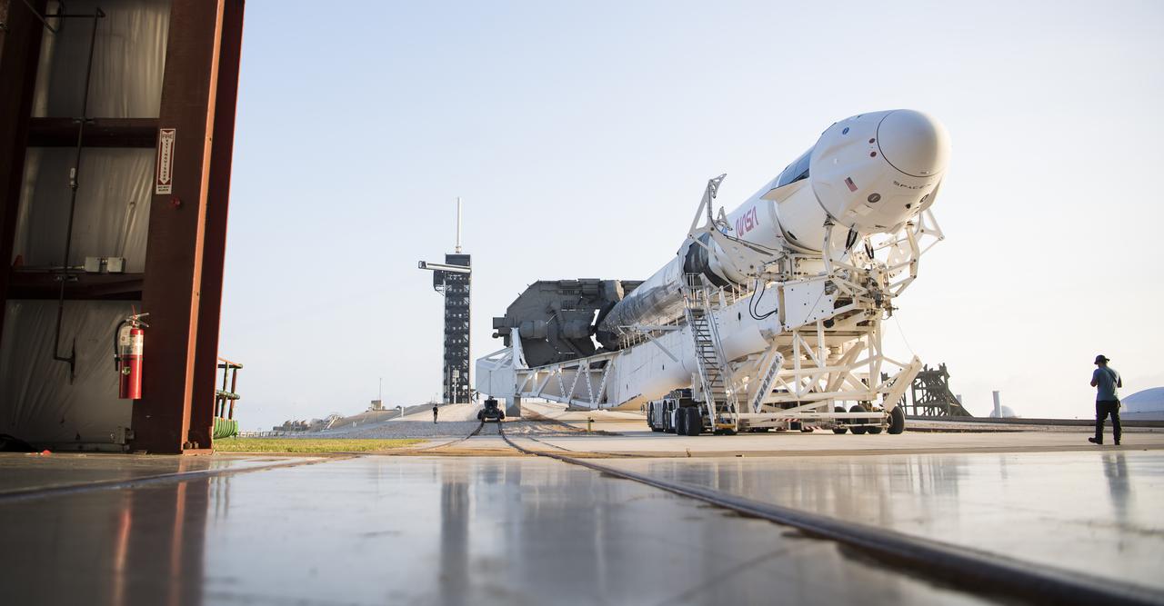 A SpaceX Falcon 9 rocket with the company's Crew Dragon spacecraft onboard is seen as it is rolled out of the horizontal integration facility at Launch Complex 39A as preparations continue for the Crew-2 mission, Friday, April 16, 2021, at NASA’s Kennedy Space Center in Florida. NASA’s SpaceX Crew-2 mission is the second crew rotation mission of the SpaceX Crew Dragon spacecraft and Falcon 9 rocket to the International Space Station as part of the agency’s Commercial Crew Program. NASA astronauts Shane Kimbrough and Megan McArthur, ESA (European Space Agency) astronaut Thomas Pesquet, and Japan Aerospace Exploration Agency (JAXA) astronaut Akihiko Hoshide are scheduled to launch at 6:11 a.m. ET on Thursday, April 22, from Launch Complex 39A at the Kennedy Space Center. Photo Credit: (NASA/Aubrey Gemignani)