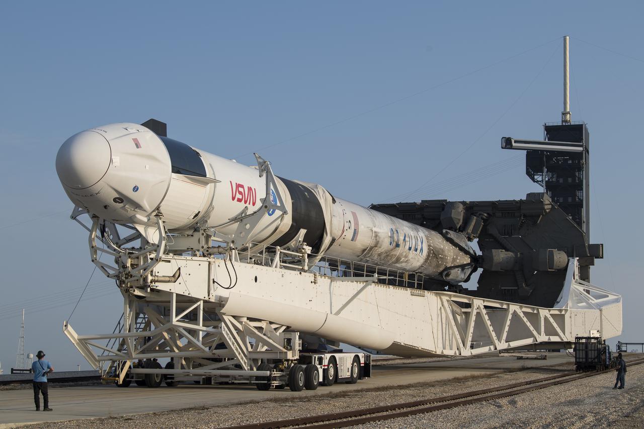 A SpaceX Falcon 9 rocket with the company's Crew Dragon spacecraft onboard is seen as it is rolled to Launch Complex 39A as preparations continue for the Crew-2 mission, Friday, April 16, 2021, at NASA’s Kennedy Space Center in Florida. NASA’s SpaceX Crew-2 mission is the second crew rotation mission of the SpaceX Crew Dragon spacecraft and Falcon 9 rocket to the International Space Station as part of the agency’s Commercial Crew Program. NASA astronauts Shane Kimbrough and Megan McArthur, ESA (European Space Agency) astronaut Thomas Pesquet, and Japan Aerospace Exploration Agency (JAXA) astronaut Akihiko Hoshide are scheduled to launch at 6:11 a.m. ET on Thursday, April 22, from Launch Complex 39A at the Kennedy Space Center. Photo Credit: (NASA/Aubrey Gemignani)