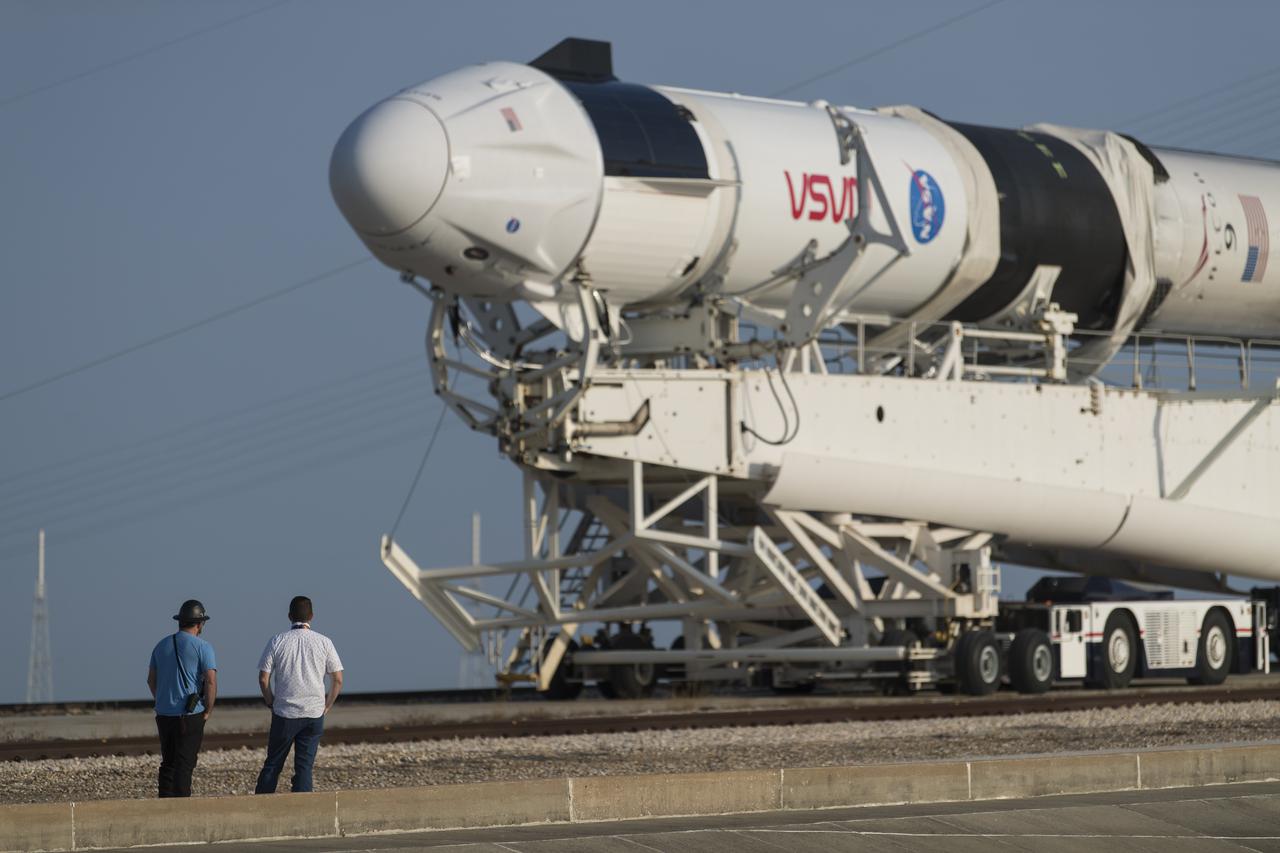A SpaceX Falcon 9 rocket with the company's Crew Dragon spacecraft onboard is seen as it is rolled to Launch Complex 39A as preparations continue for the Crew-2 mission, Friday, April 16, 2021, at NASA’s Kennedy Space Center in Florida. NASA’s SpaceX Crew-2 mission is the second crew rotation mission of the SpaceX Crew Dragon spacecraft and Falcon 9 rocket to the International Space Station as part of the agency’s Commercial Crew Program. NASA astronauts Shane Kimbrough and Megan McArthur, ESA (European Space Agency) astronaut Thomas Pesquet, and Japan Aerospace Exploration Agency (JAXA) astronaut Akihiko Hoshide are scheduled to launch at 6:11 a.m. ET on Thursday, April 22, from Launch Complex 39A at the Kennedy Space Center. Photo Credit: (NASA/Aubrey Gemignani)