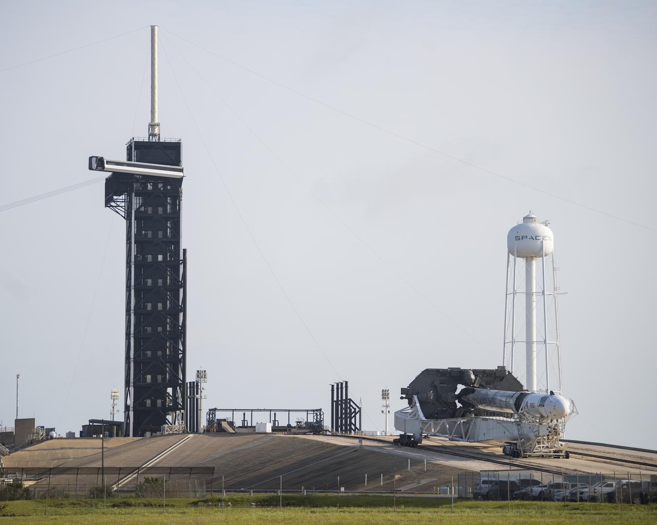 A SpaceX Falcon 9 rocket with the company's Crew Dragon spacecraft onboard is seen as it is rolled to Launch Complex 39A as preparations continue for the Crew-2 mission, Friday, April 16, 2021, at NASA’s Kennedy Space Center in Florida. NASA’s SpaceX Crew-2 mission is the second crew rotation mission of the SpaceX Crew Dragon spacecraft and Falcon 9 rocket to the International Space Station as part of the agency’s Commercial Crew Program. NASA astronauts Shane Kimbrough and Megan McArthur, ESA (European Space Agency) astronaut Thomas Pesquet, and Japan Aerospace Exploration Agency (JAXA) astronaut Akihiko Hoshide are scheduled to launch at 6:11 a.m. ET on Thursday, April 22, from Launch Complex 39A at the Kennedy Space Center. Photo Credit: (NASA/Aubrey Gemignani)