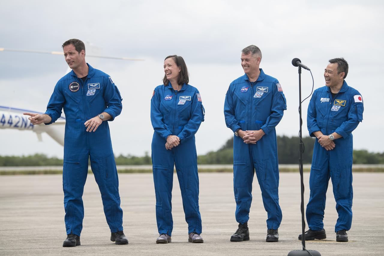 From left to right, ESA (European Space Agency) astronaut Thomas Pesquet, NASA astronauts Megan McArthur and Shane Kimbrough, and Japan Aerospace Exploration Agency (JAXA) astronaut Akihiko Hoshide, react to comments after arriving at the Launch and Landing Facility at NASA’s Kennedy Space Center ahead of SpaceX’s Crew-2 mission, Friday, April 16, 2021, in Florida. NASA’s SpaceX Crew-2 mission is the second operational mission of the SpaceX Crew Dragon spacecraft and Falcon 9 rocket to the International Space Station as part of the agency’s Commercial Crew Program. Kimbrough, McArthur, Pesquet, and Hoshide are scheduled to launch at 6:11 a.m. ET on Thursday, April 22, from Launch Complex 39A at the Kennedy Space Center. Photo Credit: (NASA/Aubrey Gemignani)