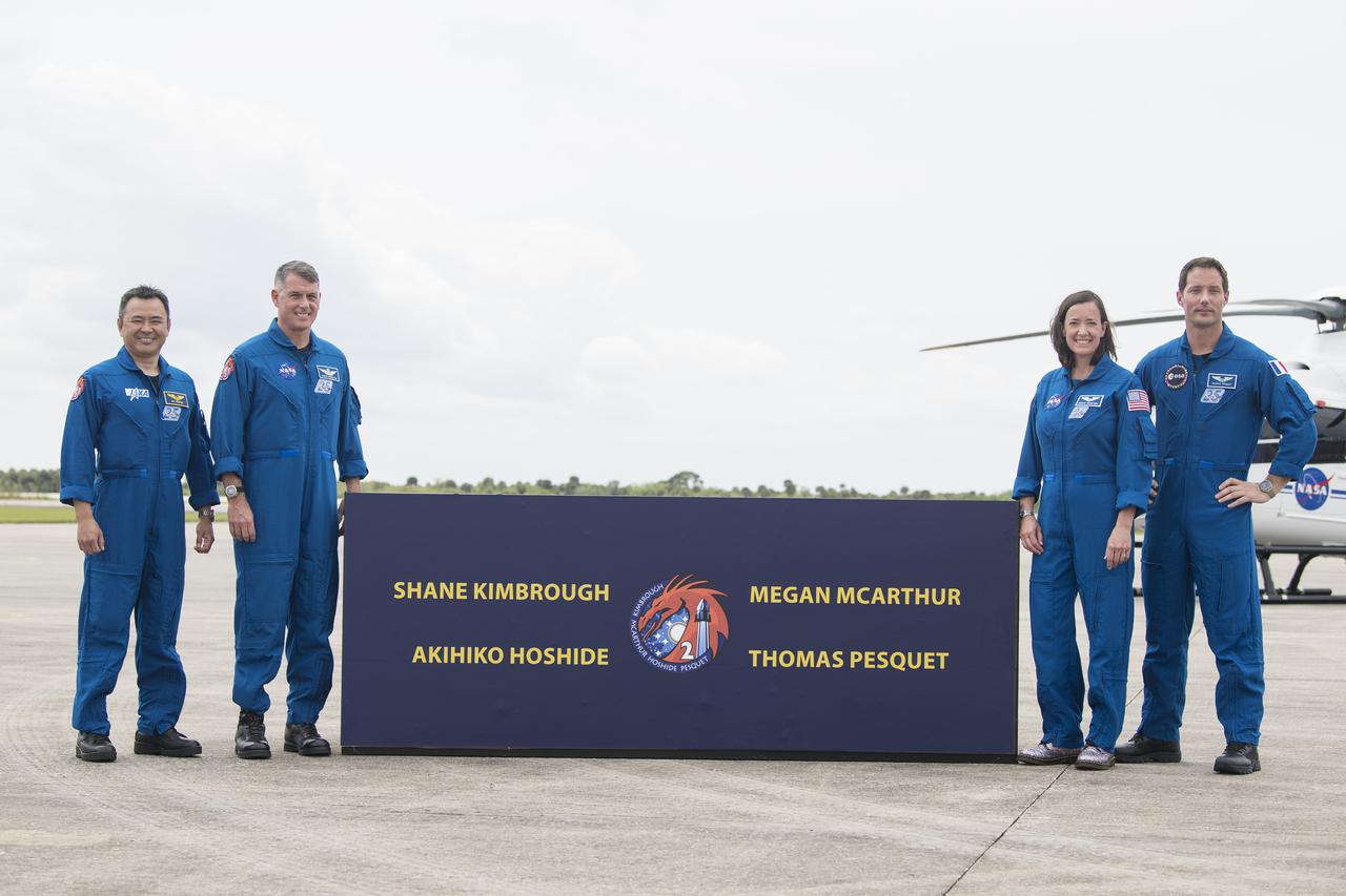 From left to right, Japan Aerospace Exploration Agency (JAXA) astronaut Akihiko Hoshide, NASA astronauts Shane Kimbrough and Megan McArthur, and ESA (European Space Agency) astronaut Thomas Pesquet pose for a photo after arriving at the Launch and Landing Facility at NASA’s Kennedy Space Center ahead of SpaceX’s Crew-2 mission, Friday, April 16, 2021, in Florida. NASA’s SpaceX Crew-2 mission is the second operational mission of the SpaceX Crew Dragon spacecraft and Falcon 9 rocket to the International Space Station as part of the agency’s Commercial Crew Program. Kimbrough, McArthur, Pesquet, and Hoshide are scheduled to launch at 6:11 a.m. ET on Thursday, April 22, from Launch Complex 39A at the Kennedy Space Center. Photo Credit: (NASA/Aubrey Gemignani)