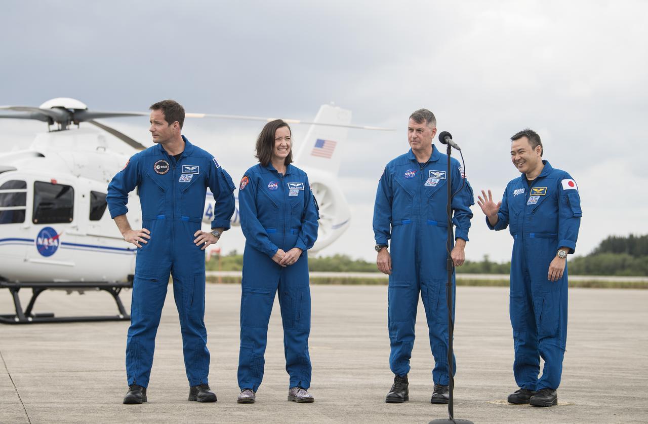 From left to right, ESA (European Space Agency) astronaut Thomas Pesquet, NASA astronauts Megan McArthur and Shane Kimbrough, and Japan Aerospace Exploration Agency (JAXA) astronaut Akihiko Hoshide, greet members of the media after arriving at the Launch and Landing Facility at NASA’s Kennedy Space Center ahead of SpaceX’s Crew-2 mission, Friday, April 16, 2021, in Florida. NASA’s SpaceX Crew-2 mission is the second operational mission of the SpaceX Crew Dragon spacecraft and Falcon 9 rocket to the International Space Station as part of the agency’s Commercial Crew Program. Kimbrough, McArthur, Pesquet, and Hoshide are scheduled to launch at 6:11 a.m. ET on Thursday, April 22, from Launch Complex 39A at the Kennedy Space Center. Photo Credit: (NASA/Aubrey Gemignani)
