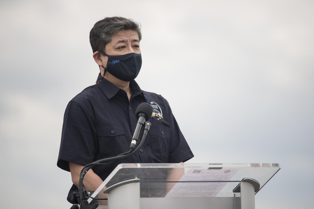 Junichi Sakai, manager of the International Space Station Program for the Japan Aerospace Exploration Agency (JAXA), speaks to members of the media after NASA astronauts Shane Kimbrough and Megan McArthur, ESA (European Space Agency) astronaut Thomas Pesquet, and Japan Aerospace Exploration Agency (JAXA) astronaut Akihiko Hoshide, arrived at the Launch and Landing Facility at NASA’s Kennedy Space Center ahead of SpaceX’s Crew-2 mission, Friday, April 16, 2021, in Florida. NASA’s SpaceX Crew-2 mission is the second operational mission of the SpaceX Crew Dragon spacecraft and Falcon 9 rocket to the International Space Station as part of the agency’s Commercial Crew Program. Kimbrough, McArthur, Pesquet, and Hoshide are scheduled to launch at 6:11 a.m. ET on Thursday, April 22, from Launch Complex 39A at the Kennedy Space Center. Photo Credit: (NASA/Aubrey Gemignani)