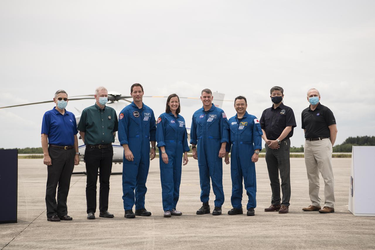 From left to right, Kennedy Space Center Director, Bob Cabana, manager of the International Space Station Program for ESA (European Space Agency), Frank De Winne, ESA astronaut Thomas Pesquet, NASA astronauts Megan McArthur and Shane Kimbrough, Japan Aerospace Exploration Agency (JAXA) astronaut Akihiko Hoshide, manager of the International Space Station Program for JAXA, Junichi Sakai, and acting NASA Administrator, Steve Jurczyk, pose for a photo after the astronauts arrived at the Launch and Landing Facility at NASA’s Kennedy Space Center ahead of SpaceX’s Crew-2 mission, Friday, April 16, 2021, in Florida. NASA’s SpaceX Crew-2 mission is the second operational mission of the SpaceX Crew Dragon spacecraft and Falcon 9 rocket to the International Space Station as part of the agency’s Commercial Crew Program. Kimbrough, McArthur, Pesquet, and Hoshide are scheduled to launch at 6:11 a.m. ET on Thursday, April 22, from Launch Complex 39A at the Kennedy Space Center. Photo Credit: (NASA/Aubrey Gemignani)