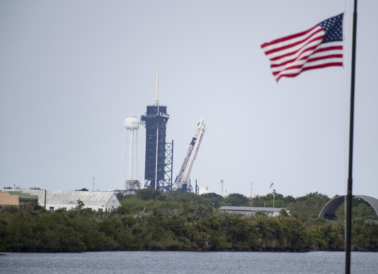 A SpaceX Falcon 9 rocket with the company's Crew Dragon spacecraft onboard is seen as it is raised into a vertical position on the launch pad at Launch Complex 39A as preparations continue for the Crew-2 mission, Friday, April 16, 2021, at NASA’s Kennedy Space Center in Florida. NASA’s SpaceX Crew-2 mission is the second crew rotation mission of the SpaceX Crew Dragon spacecraft and Falcon 9 rocket to the International Space Station as part of the agency’s Commercial Crew Program. NASA astronauts Shane Kimbrough and Megan McArthur, ESA (European Space Agency) astronaut Thomas Pesquet, and Japan Aerospace Exploration Agency (JAXA) astronaut Akihiko Hoshide are scheduled to launch at 6:11 a.m. ET on Thursday, April 22, from Launch Complex 39A at the Kennedy Space Center. Photo Credit: (NASA/Aubrey Gemignani)