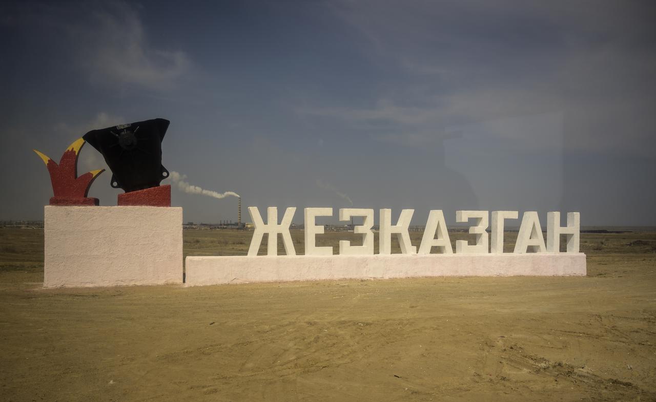 The sign for the town of Zhezkazgan is seen out of a is window as teams from NASA, Roscosmos, and Russian Search and Recovery Forces arrive to prepare for the Soyuz MS-17 landing of Expedition 64 crew members Kate Rubins of NASA, Sergey Ryzhikov and Sergey Kud-Sverchkov of Roscosmos, Friday, April 16, 2021. Rubins, Ryzhikov and Kud-Sverchkov will be returning April 17b after 185 days in space having served as Expedition 63-64 crew members onboard the International Space Station. Photo Credit: NASA/Bill Ingalls