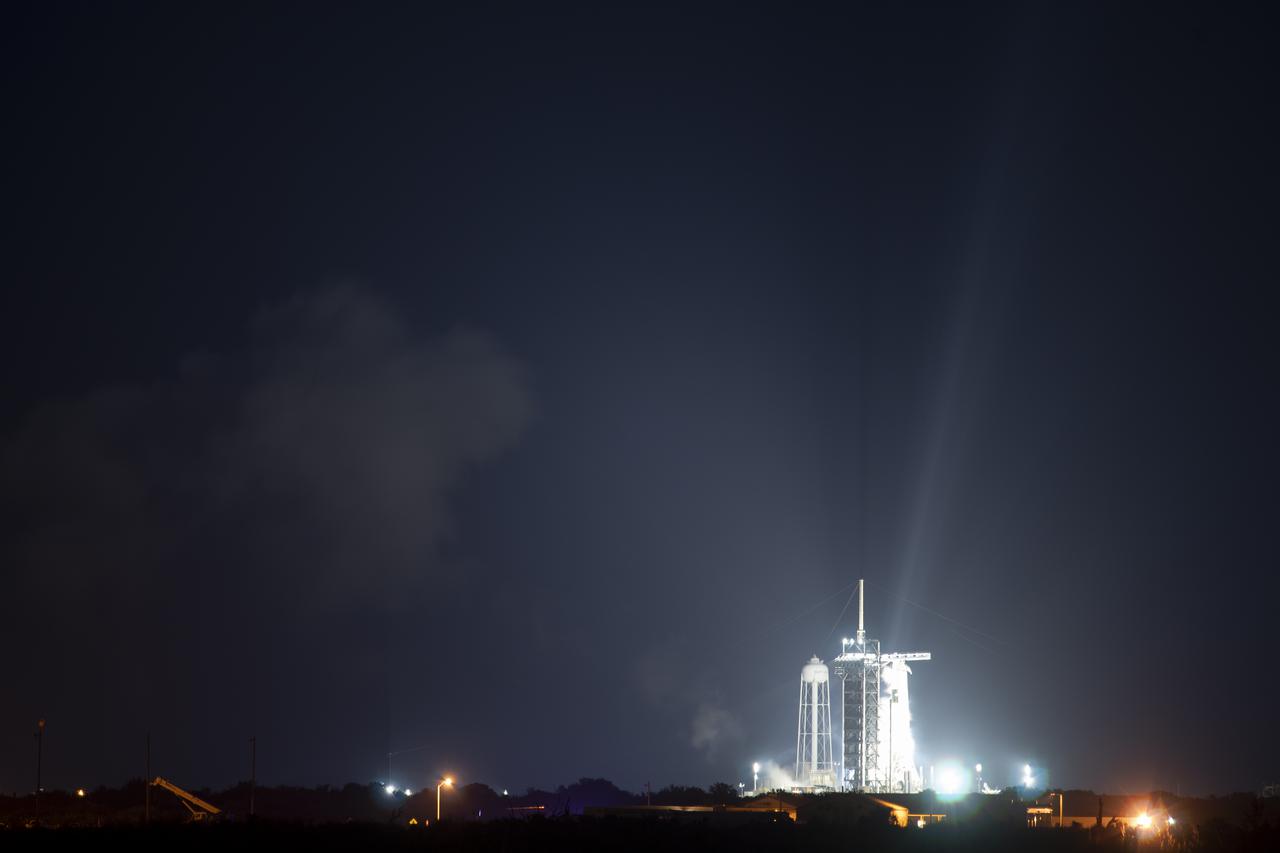 A SpaceX Falcon 9 rocket with the company's Crew Dragon spacecraft onboard is seen on the launch pad at Launch Complex 39A following a brief static fire test ahead of NASA’s SpaceX Crew-2 mission, Saturday, April 17, 2021, at NASA’s Kennedy Space Center in Florida. NASA’s SpaceX Crew-2 mission is the second crew rotation mission of the SpaceX Crew Dragon spacecraft and Falcon 9 rocket to the International Space Station as part of the agency’s Commercial Crew Program. NASA astronauts Shane Kimbrough and Megan McArthur, ESA (European Space Agency) astronaut Thomas Pesquet, and Japan Aerospace Exploration Agency (JAXA) astronaut Akihiko Hoshide are scheduled to launch at 6:11 a.m. ET on Thursday, April 22, from Launch Complex 39A at the Kennedy Space Center. Photo Credit: (NASA/Joel Kowsky)