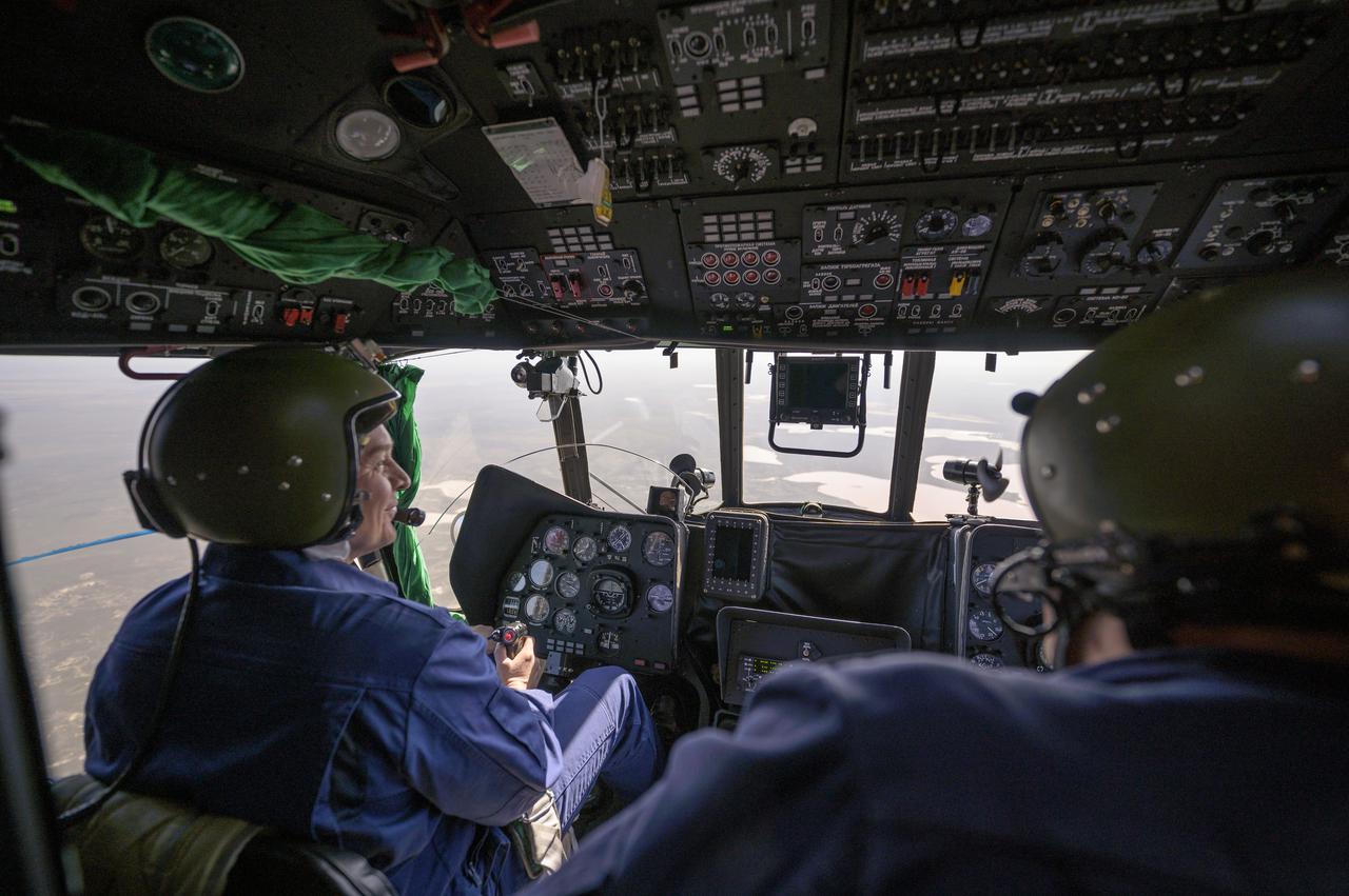 Helicopter pilots navigate to the designated landing zone for the landing of the Soyuz MS-17 with Expedition 64 crew members Kate Rubins of NASA, Sergey Ryzhikov and Sergey Kud-Sverchkov of Roscosmos onboard, Saturday, April 17, 2021. Rubins, Ryzhikov and Kud-Sverchkov returned after 185 days in space having served as Expedition 63-64 crew members onboard the International Space Station. Photo Credit: NASA/Bill Ingalls