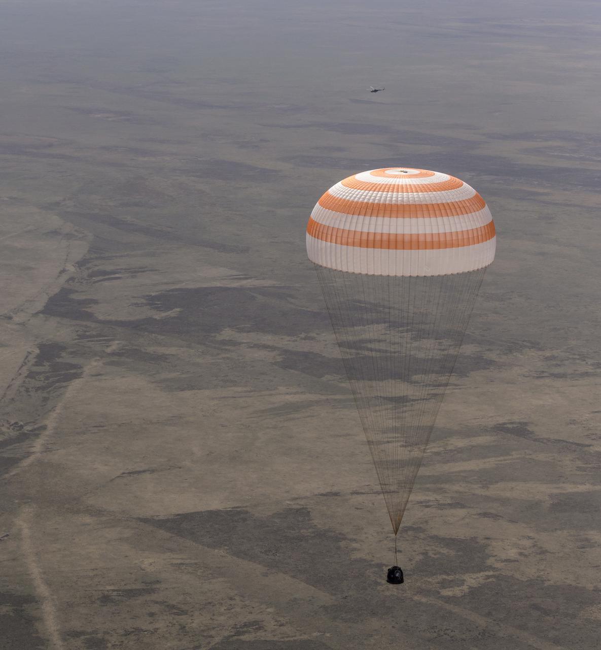 The Soyuz MS-17 spacecraft is seen as it lands in a remote area near the town of Zhezkazgan, Kazakhstan with Expedition 64 crew members Kate Rubins of NASA, Sergey Ryzhikov and Sergey Kud-Sverchkov of Roscosmos, Saturday, April 17, 2021. Rubins, Ryzhikov and Kud-Sverchkov returned after 185 days in space having served as Expedition 63-64 crew members onboard the International Space Station. Photo Credit: NASA/Bill Ingalls