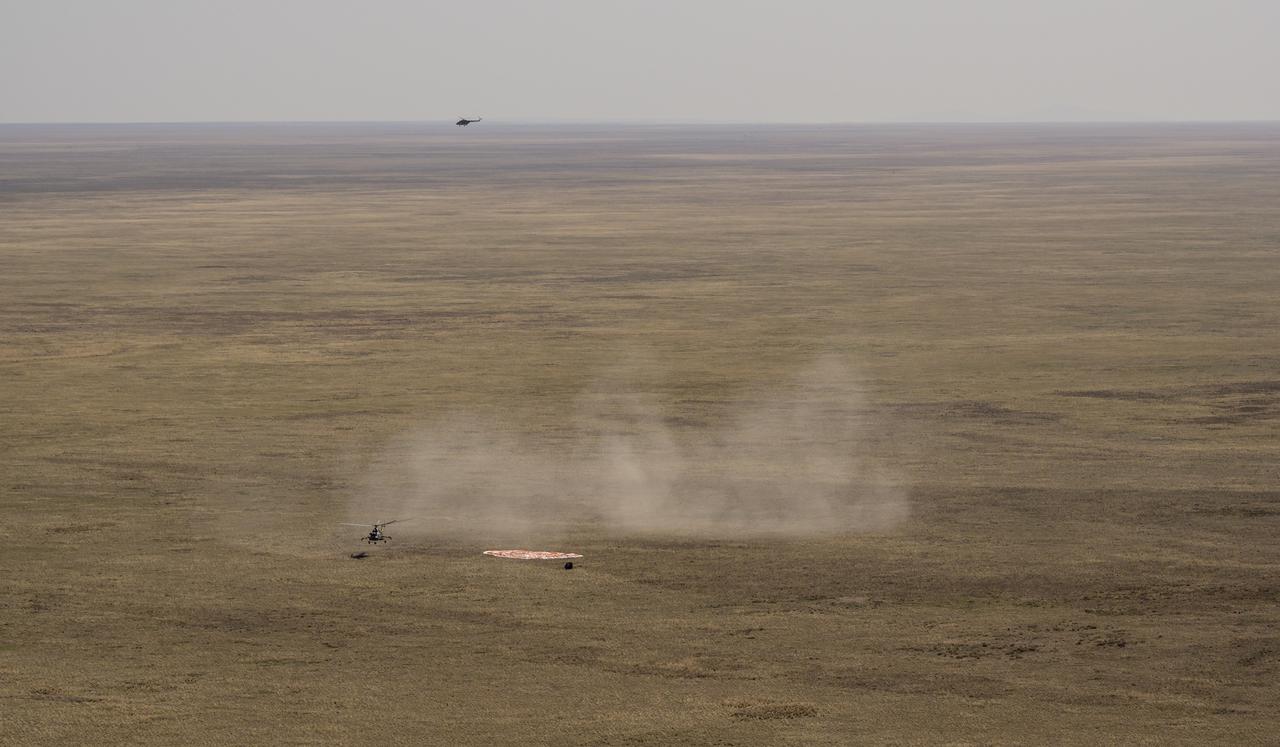Russian Search and Rescue teams arrive at the Soyuz MS-17 spacecraft shortly after it landed in a remote area near the town of Zhezkazgan, Kazakhstan with Expedition 64 crew members Kate Rubins of NASA, Sergey Ryzhikov and Sergey Kud-Sverchkov of Roscosmos, Saturday, April 17, 2021. Rubins, Ryzhikov and Kud-Sverchkov returned after 185 days in space having served as Expedition 63-64 crew members onboard the International Space Station. Photo Credit: NASA/Bill Ingalls