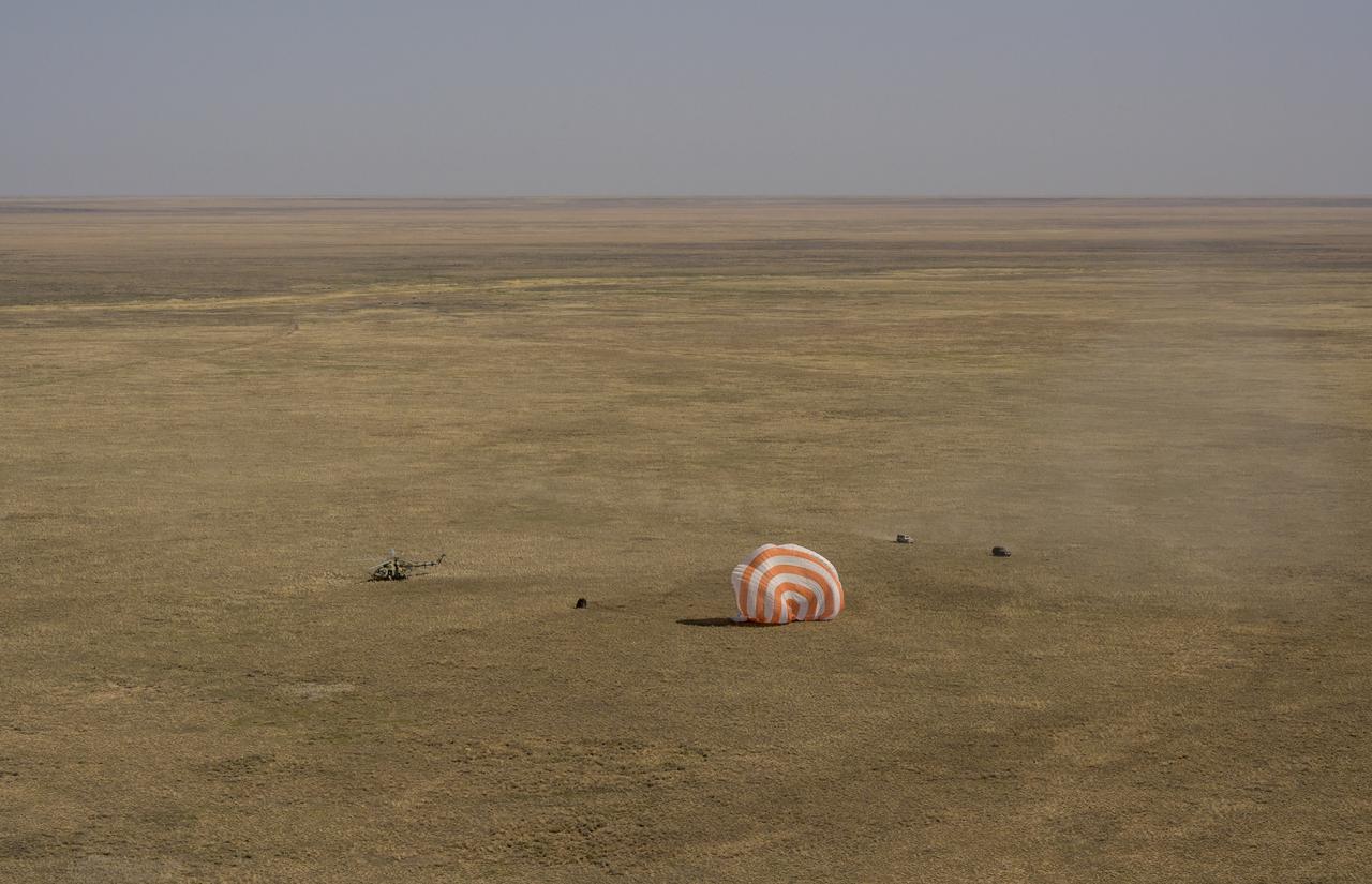 Russian Search and Rescue teams arrive at the Soyuz MS-17 spacecraft shortly after it landed in a remote area near the town of Zhezkazgan, Kazakhstan with Expedition 64 crew members Kate Rubins of NASA, Sergey Ryzhikov and Sergey Kud-Sverchkov of Roscosmos, Saturday, April 17, 2021. Rubins, Ryzhikov and Kud-Sverchkov returned after 185 days in space having served as Expedition 63-64 crew members onboard the International Space Station. Photo Credit: NASA/Bill Ingalls