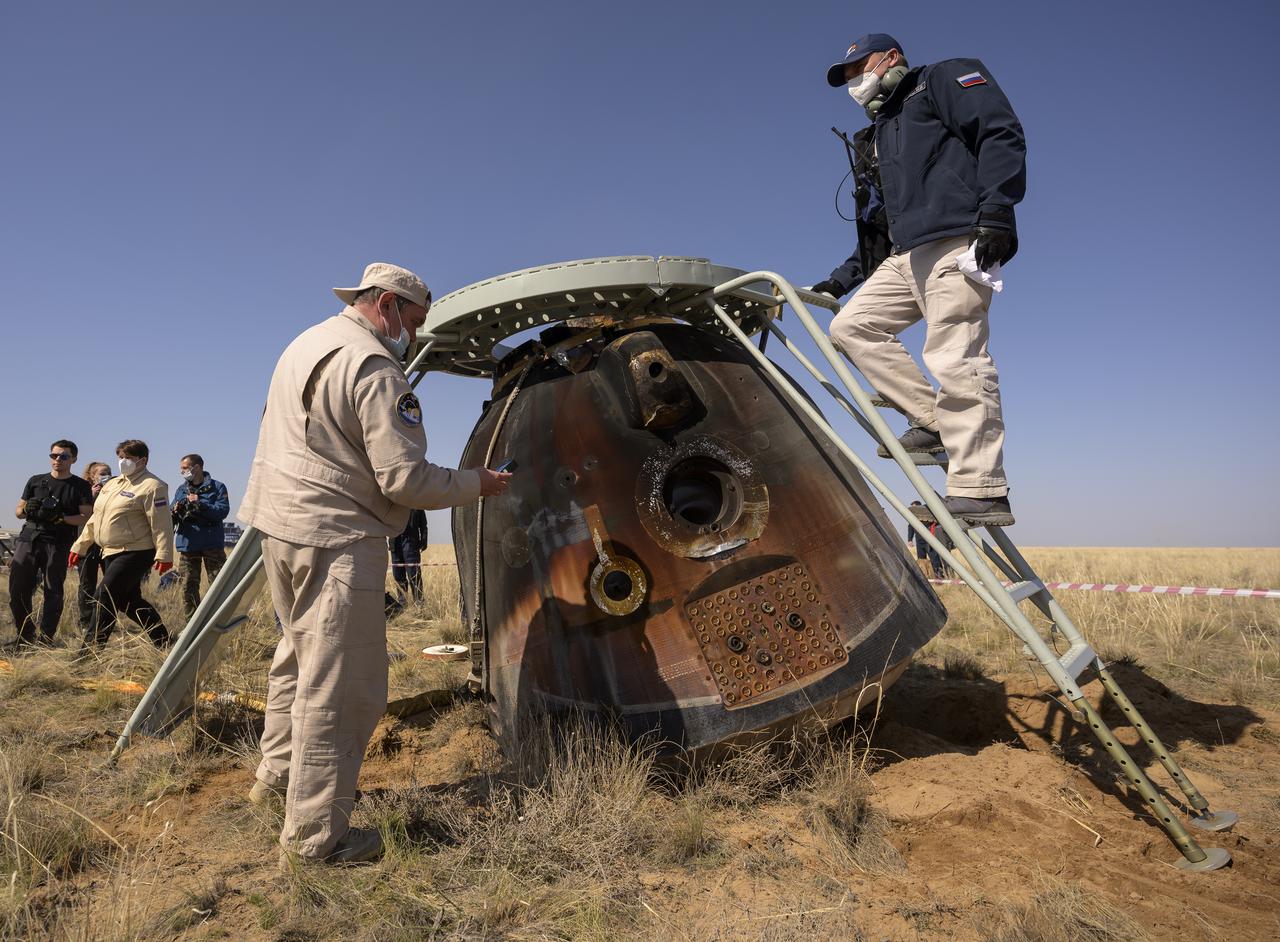 Russian Search and Rescue teams arrive at the Soyuz MS-17 spacecraft shortly after it landed in a remote area near the town of Zhezkazgan, Kazakhstan with Expedition 64 crew members Kate Rubins of NASA, Sergey Ryzhikov and Sergey Kud-Sverchkov of Roscosmos, Saturday, April 17, 2021. Rubins, Ryzhikov and Kud-Sverchkov returned after 185 days in space having served as Expedition 63-64 crew members onboard the International Space Station. Photo Credit: NASA/Bill Ingalls