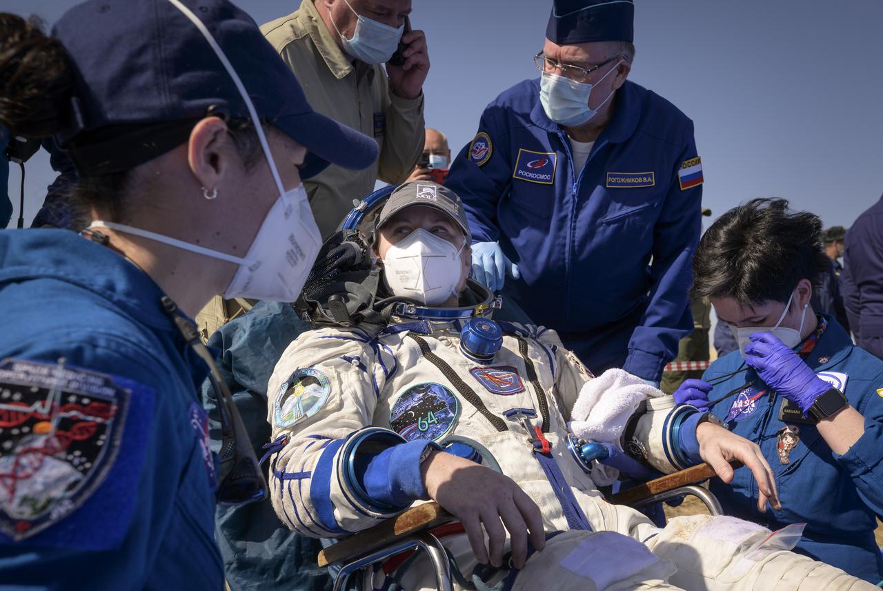 Expedition 64 NASA astronaut Kate Rubins rest as NASA Flight Surgeon Natacha Chough, left, and Russian Nurse Raksana Batsmanova, right, monitor her condition after she, and Roscosmos cosmonauts Sergey Ryzhikov and Sergey Kud-Sverchkov landed there Soyuz MS-17 spacecraft in a remote area near the town of Zhezkazgan, Kazakhstan on Saturday, April 17, 2021. Rubins, Ryzhikov and Kud-Sverchkov returned after 185 days in space having served as Expedition 63-64 crew members onboard the International Space Station. Photo Credit: NASA/Bill Ingalls
