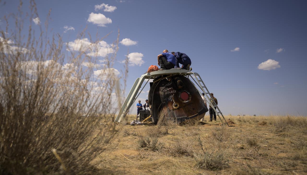 Russian support personnel work around the Soyuz MS-17 spacecraft shortly after it landed n a remote area near the town of Zhezkazgan, Kazakhstan with Expedition 64 crew members Kate Rubins of NASA, Sergey Ryzhikov and Sergey Kud-Sverchkov of Roscosmos, Saturday, April 17, 2021. Rubins, Ryzhikov and Kud-Sverchkov returned after 185 days in space having served as Expedition 63-64 crew members onboard the International Space Station. Photo Credit: NASA/Bill Ingalls