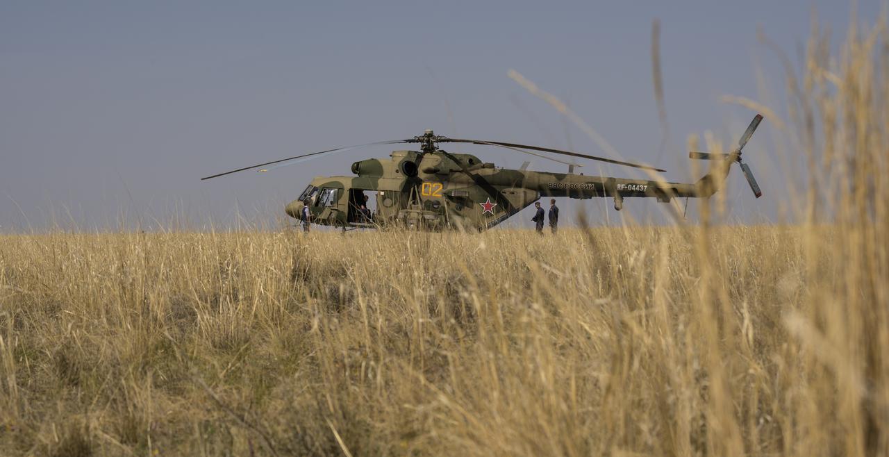 A Russian MI-8 helicopter waits at the Soyuz MS-17 landing site to take Expedition 64 crew members to the Karaganda Airport after NASA astronaut Kate Rubins, and Roscosmos cosmonauts Sergey Ryzhikov and Sergey Kud-Sverchkov landed in their Soyuz MS-17 spacecraft near the town of Zhezkazgan, Kazakhstan on Saturday, April 17, 2021. Rubins, Ryzhikov and Kud-Sverchkov returned after 185 days in space having served as Expedition 63-64 crew members onboard the International Space Station. Photo Credit: NASA/Bill Ingalls