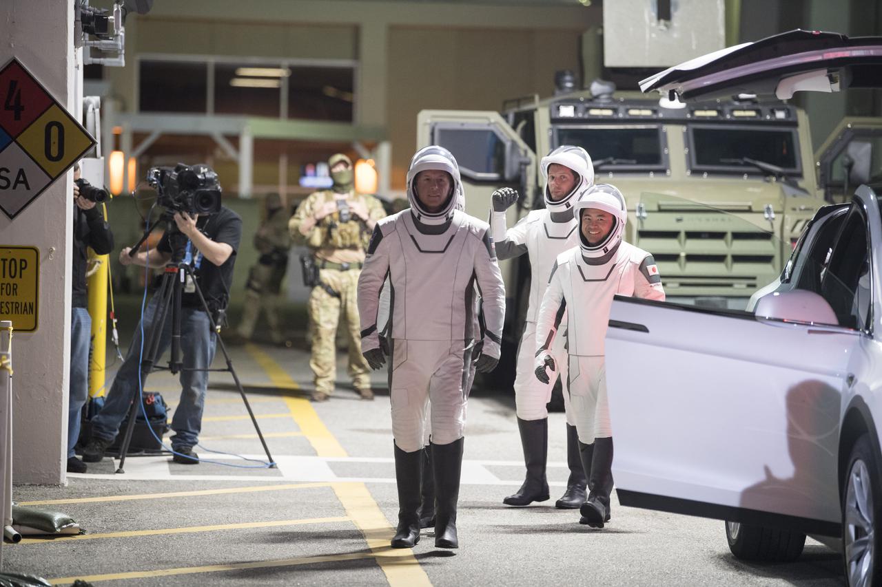 NASA astronauts Shane Kimbrough, front, and ESA (European Space Agency) astronaut Thomas Pesquet, back left, and Japan Aerospace Exploration Agency (JAXA) astronaut Akihiko Hoshide, wearing SpaceX spacesuits, are seen as they prepare to depart the Neil A. Armstrong Operations and Checkout Building for Launch Complex 39A during a dress rehearsal prior to the Crew-2 mission launch, Sunday, April 18, 2021, at NASA’s Kennedy Space Center in Florida. NASA’s SpaceX Crew-2 mission is the second operational mission of the SpaceX Crew Dragon spacecraft and Falcon 9 rocket to the International Space Station as part of the agency’s Commercial Crew Program. Kimbrough, McArthur, Pesquet, and Hoshide are scheduled to launch at 6:11 a.m. ET on Thursday, April 22, from Launch Complex 39A at the Kennedy Space Center. Photo Credit: (NASA/Aubrey Gemignani)