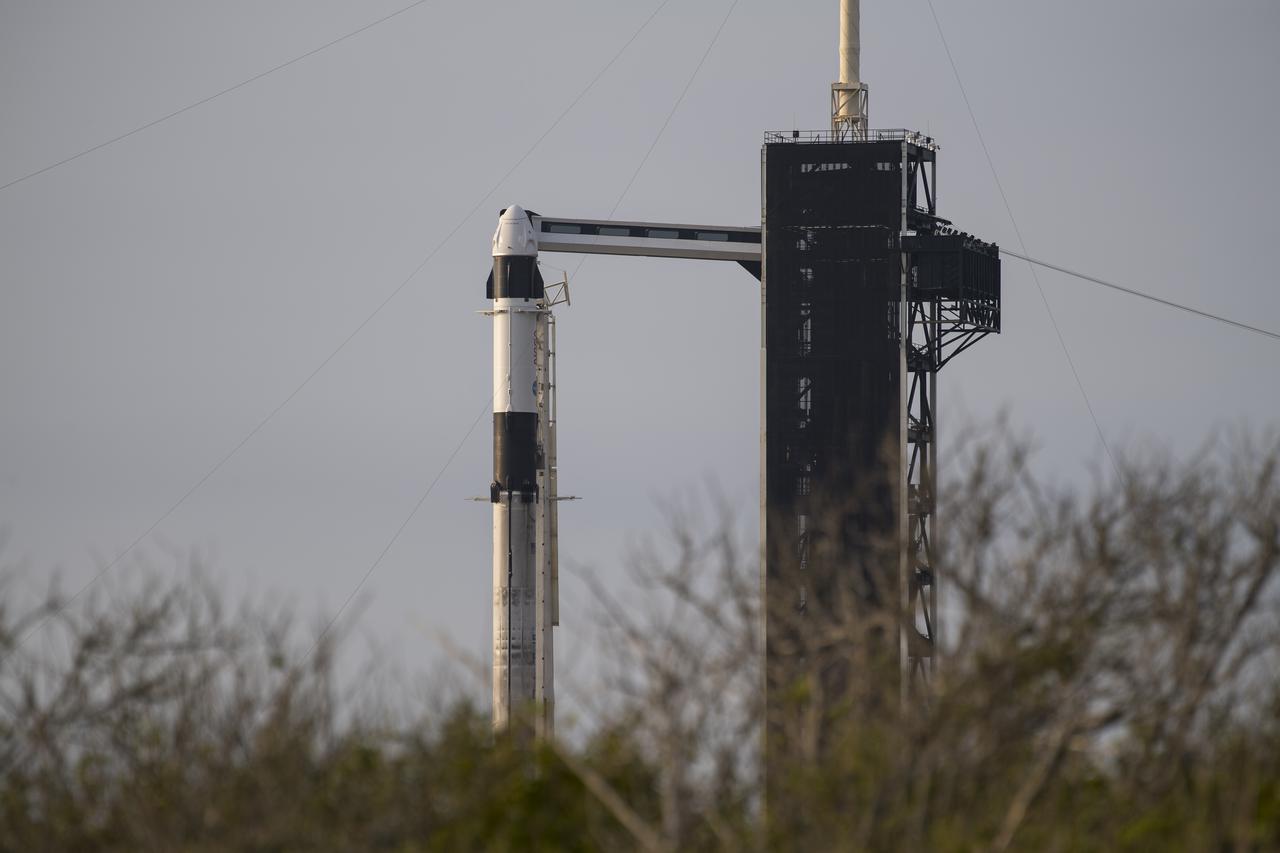 A SpaceX Falcon 9 rocket with the company's Crew Dragon spacecraft onboard is seen on the launch pad at Launch Complex 39A as preparations continue for the Crew-2 mission, Sunday, April 18, 2021, at NASA’s Kennedy Space Center in Florida. NASA’s SpaceX Crew-2 mission is the second crew rotation mission of the SpaceX Crew Dragon spacecraft and Falcon 9 rocket to the International Space Station as part of the agency’s Commercial Crew Program. NASA astronauts Shane Kimbrough and Megan McArthur, ESA (European Space Agency) astronaut Thomas Pesquet, and Japan Aerospace Exploration Agency (JAXA) astronaut Akihiko Hoshide are scheduled to launch at 6:11 a.m. ET on Thursday, April 22, from Launch Complex 39A at the Kennedy Space Center. Photo Credit: (NASA/Aubrey Gemignani)