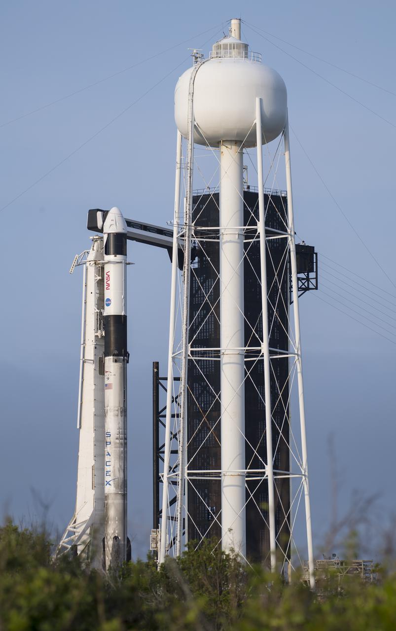 A SpaceX Falcon 9 rocket with the company's Crew Dragon spacecraft onboard is seen on the launch pad at Launch Complex 39A as preparations continue for the Crew-2 mission, Sunday, April 18, 2021, at NASA’s Kennedy Space Center in Florida. NASA’s SpaceX Crew-2 mission is the second crew rotation mission of the SpaceX Crew Dragon spacecraft and Falcon 9 rocket to the International Space Station as part of the agency’s Commercial Crew Program. NASA astronauts Shane Kimbrough and Megan McArthur, ESA (European Space Agency) astronaut Thomas Pesquet, and Japan Aerospace Exploration Agency (JAXA) astronaut Akihiko Hoshide are scheduled to launch at 6:11 a.m. ET on Thursday, April 22, from Launch Complex 39A at the Kennedy Space Center. Photo Credit: (NASA/Aubrey Gemignani)