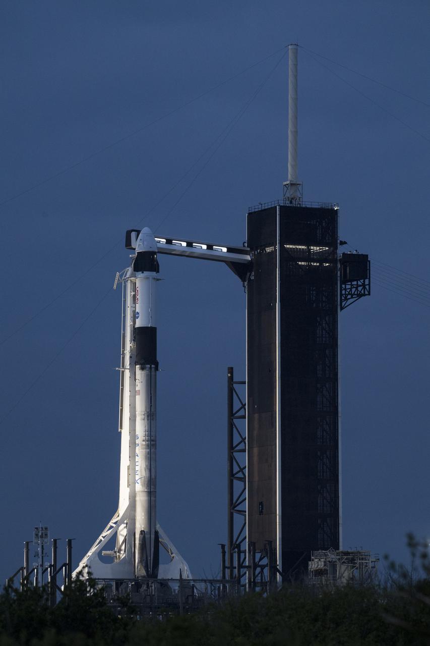 A SpaceX Falcon 9 rocket with the company's Crew Dragon spacecraft onboard is seen on the launch pad at Launch Complex 39A as preparations continue for the Crew-2 mission, Wednesday, April 21, 2021, at NASA’s Kennedy Space Center in Florida. NASA’s SpaceX Crew-2 mission is the second crew rotation mission of the SpaceX Crew Dragon spacecraft and Falcon 9 rocket to the International Space Station as part of the agency’s Commercial Crew Program. NASA astronauts Shane Kimbrough and Megan McArthur, ESA (European Space Agency) astronaut Thomas Pesquet, and Japan Aerospace Exploration Agency (JAXA) astronaut Akihiko Hoshide are scheduled to launch at 5:49 a.m. EDT on Friday, April 23, from Launch Complex 39A at the Kennedy Space Center. Photo Credit: (NASA/Aubrey Gemignani)