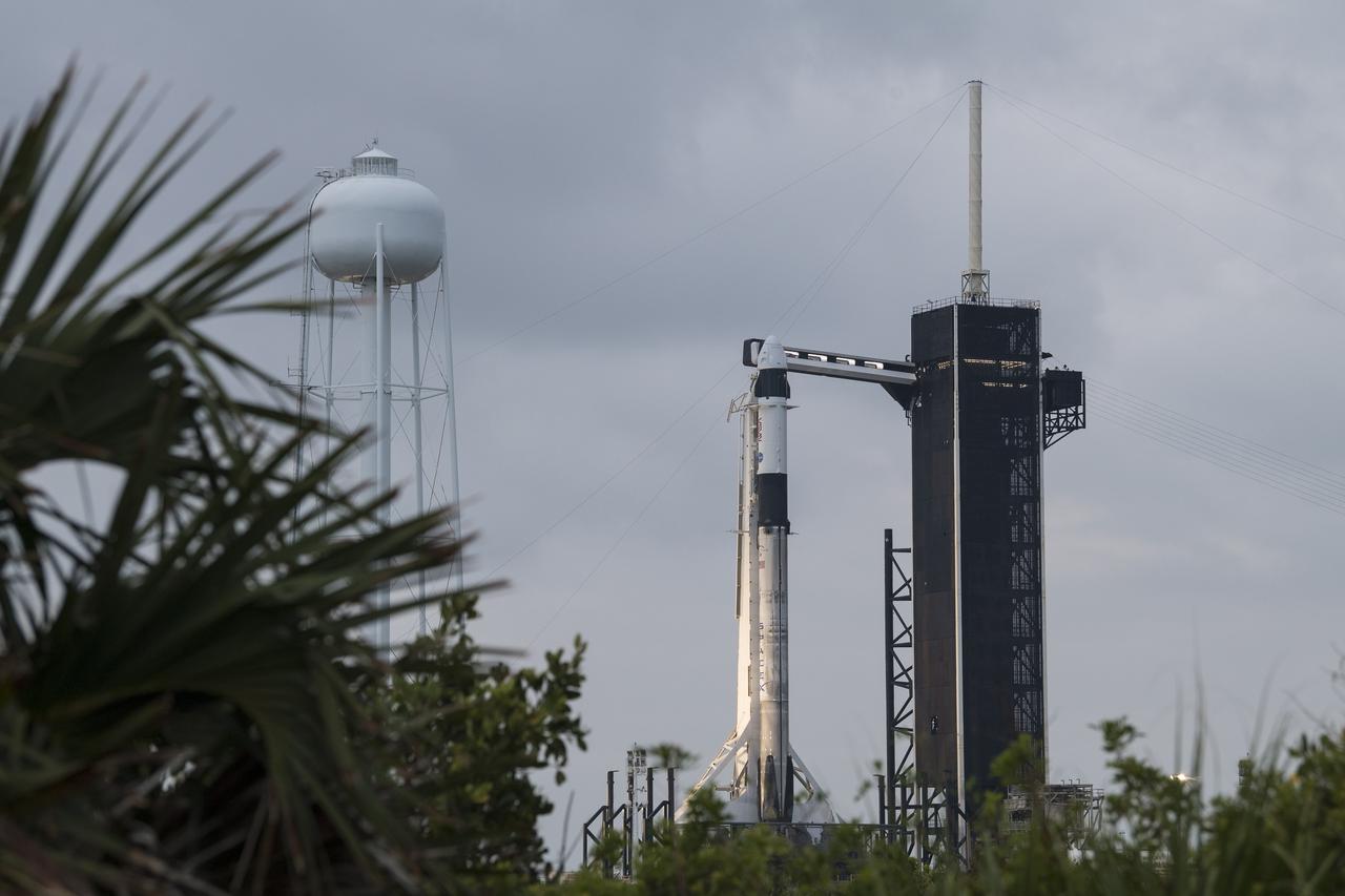 A SpaceX Falcon 9 rocket with the company's Crew Dragon spacecraft onboard is seen on the launch pad at Launch Complex 39A as preparations continue for the Crew-2 mission, Wednesday, April 21, 2021, at NASA’s Kennedy Space Center in Florida. NASA’s SpaceX Crew-2 mission is the second crew rotation mission of the SpaceX Crew Dragon spacecraft and Falcon 9 rocket to the International Space Station as part of the agency’s Commercial Crew Program. NASA astronauts Shane Kimbrough and Megan McArthur, ESA (European Space Agency) astronaut Thomas Pesquet, and Japan Aerospace Exploration Agency (JAXA) astronaut Akihiko Hoshide are scheduled to launch at 5:49 a.m. EDT on Friday, April 23, from Launch Complex 39A at the Kennedy Space Center. Photo Credit: (NASA/Aubrey Gemignani)