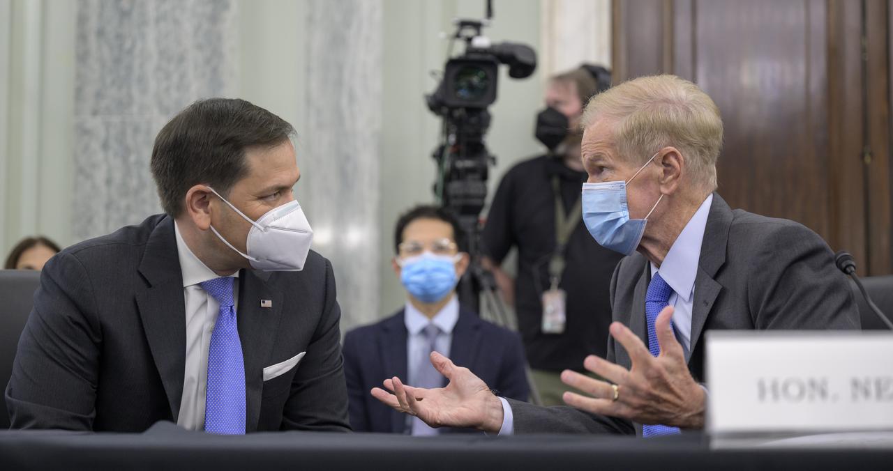 Former U.S. Senator Bill Nelson, President Biden’s nominee to be the next administrator of NASA, right, talks with Sen. Marco Rubio, R-Fla., as Nelson appears before the Senate Committee on Commerce, Science, and Transportation, Wednesday, April 21, 2021, Russell Senate Office Building in Washington. Photo Credit: (NASA/Bill Ingalls)