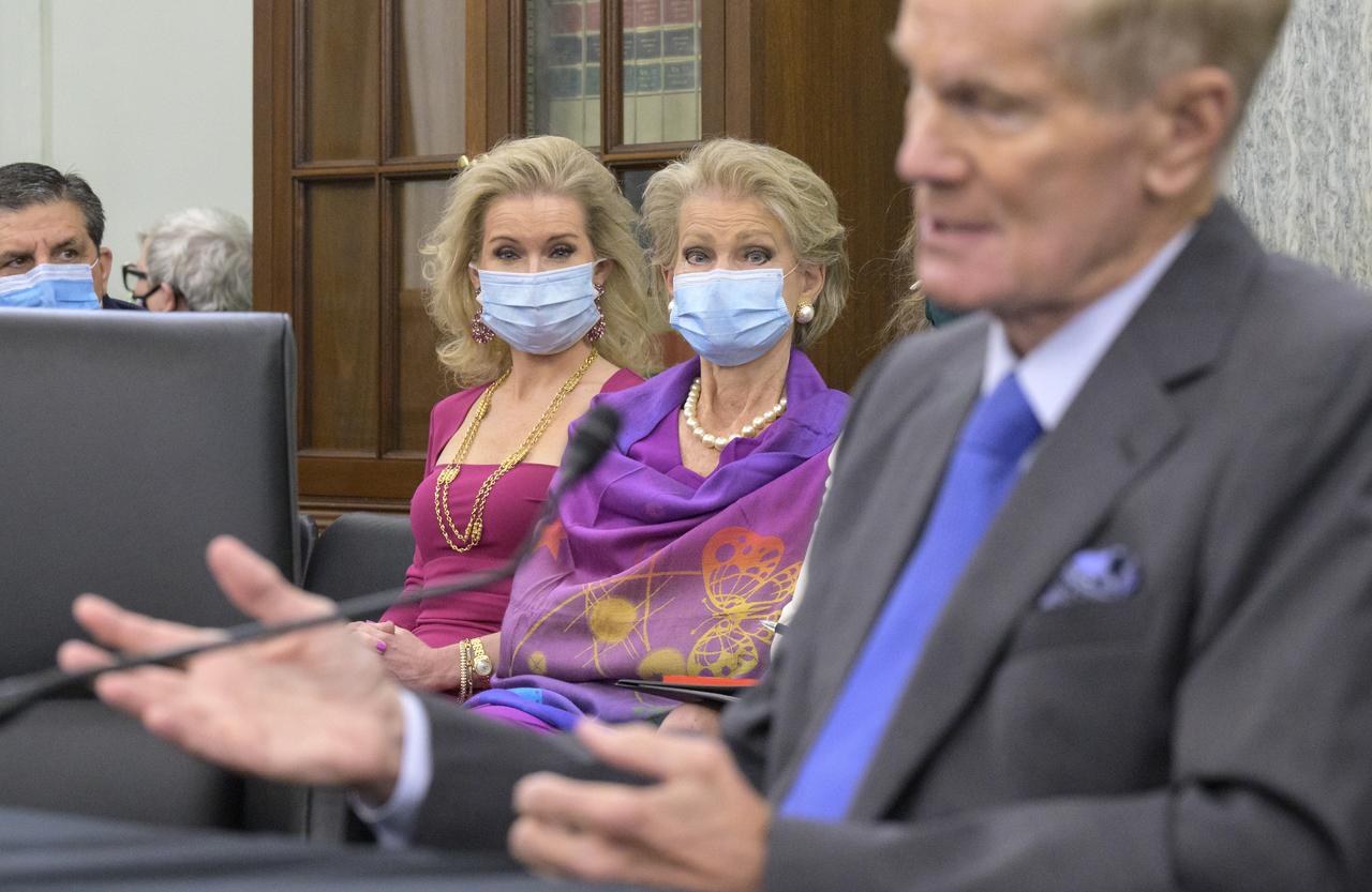 Former U.S. Senator Bill Nelson’s daughter, Nan Ellen Nelson, left, and his wife Grace Nelson, listen as Bill Nelson, President Biden’s nominee to be the next administrator of NASA, appears before the Senate Committee on Commerce, Science, and Transportation, Wednesday, April 21, 2021, Russell Senate Office Building in Washington. Photo Credit: (NASA/Bill Ingalls)