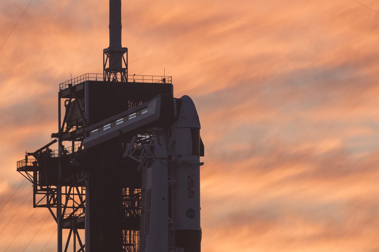 A SpaceX Falcon 9 rocket with the company's Crew Dragon spacecraft onboard is seen at sunset on the launch pad at Launch Complex 39A as preparations continue for the Crew-2 mission, Wednesday, April 21, 2021, at NASA’s Kennedy Space Center in Florida. NASA’s SpaceX Crew-2 mission is the second crew rotation mission of the SpaceX Crew Dragon spacecraft and Falcon 9 rocket to the International Space Station as part of the agency’s Commercial Crew Program. NASA astronauts Shane Kimbrough and Megan McArthur, ESA (European Space Agency) astronaut Thomas Pesquet, and Japan Aerospace Exploration Agency (JAXA) astronaut Akihiko Hoshide are scheduled to launch at 5:49 a.m. EDT on Friday, April 23, from Launch Complex 39A at the Kennedy Space Center. Photo Credit: (NASA/Joel Kowsky)